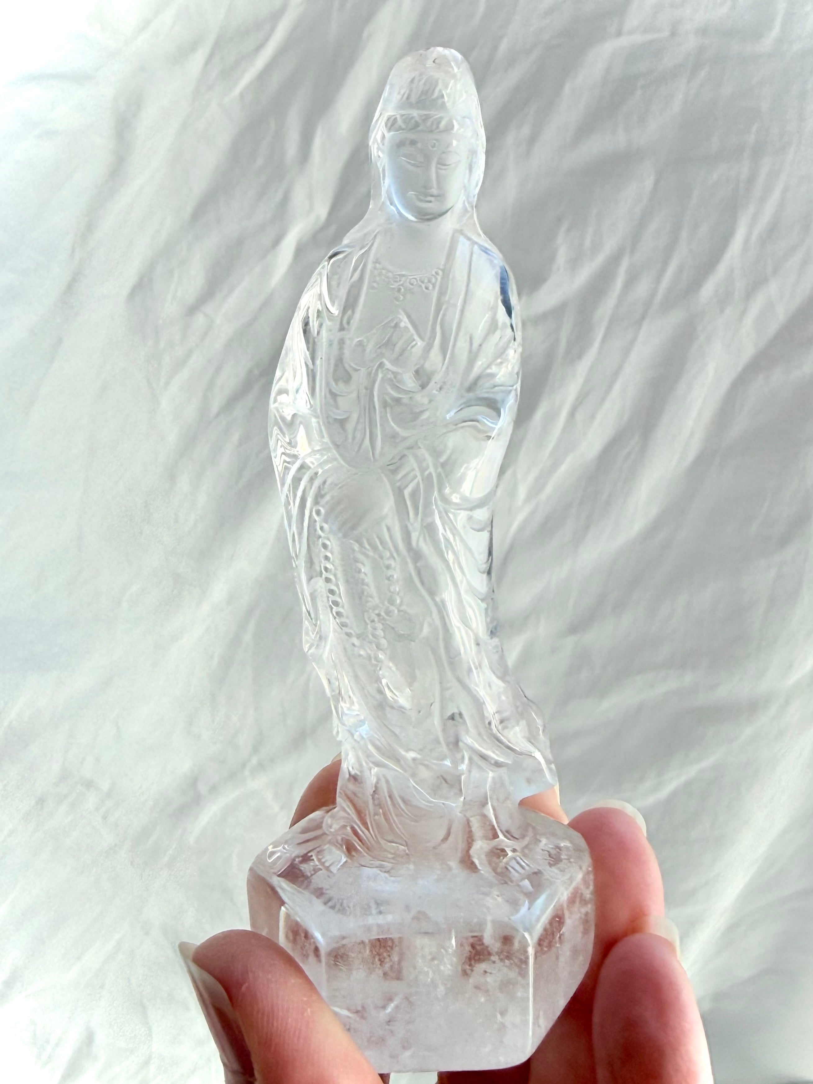 Clear Quartz Quan Yin statue carved from luminous crystal with exceptional clarity and serene goddess details 