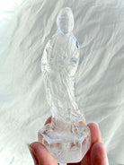 Clear Quartz Quan Yin statue carved from luminous crystal with exceptional clarity and serene goddess details 