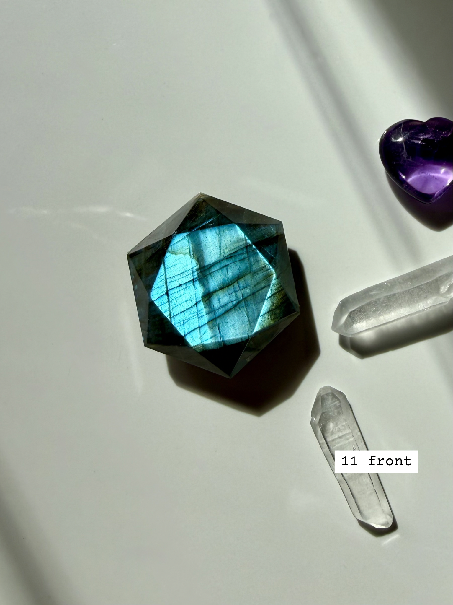 faceted labradorite hexagon crystal for third eye chakra and intuition with vivid blue fire front view number 11