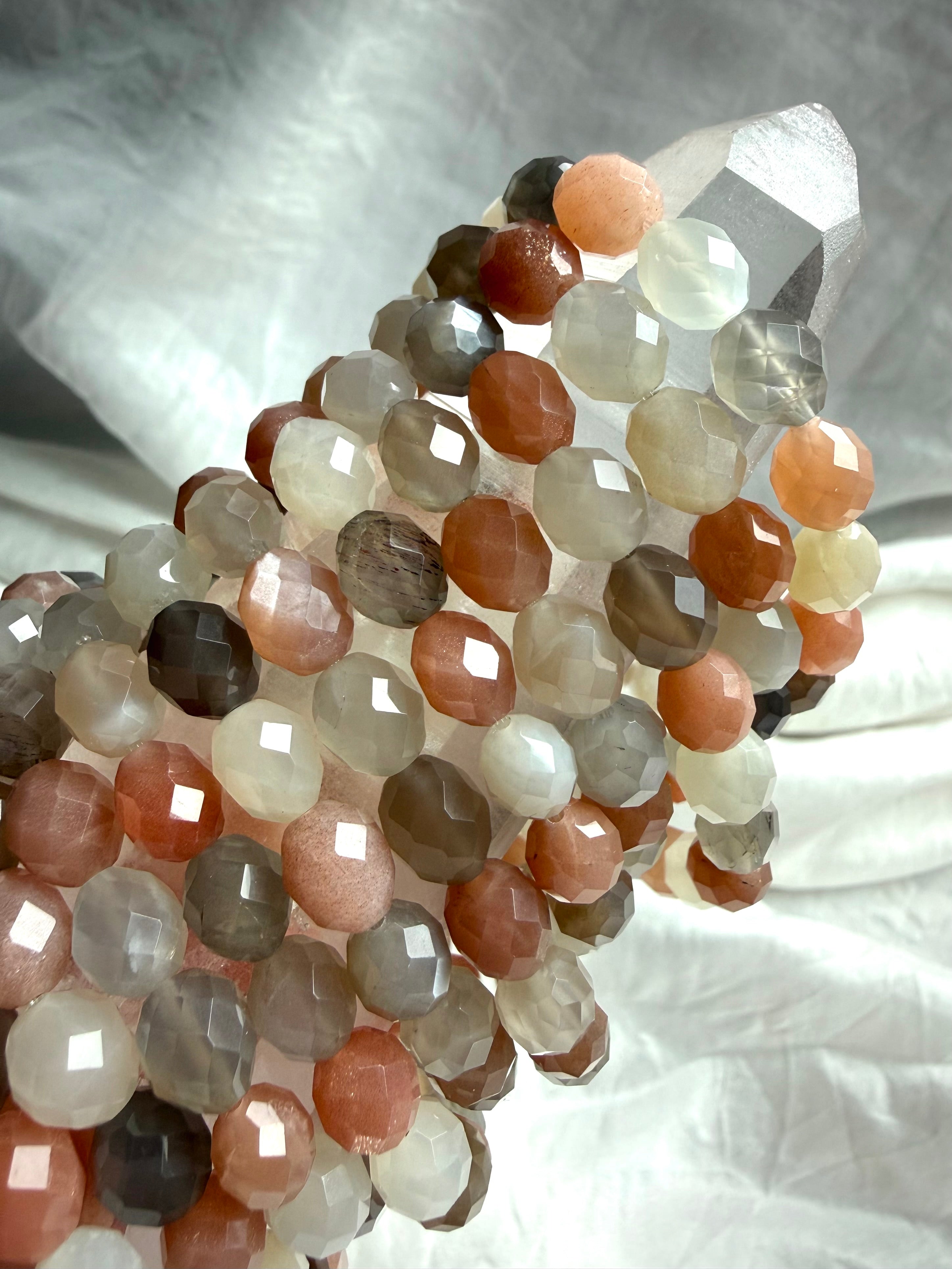 Faceted Moonstone bracelets with peach, silvery gray, taupe, and creamy white gemstones featuring natural shimmer and sparkling oval facets