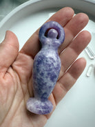 Our purple Lepidolite Standing Goddess Statue shown on my hand for scale