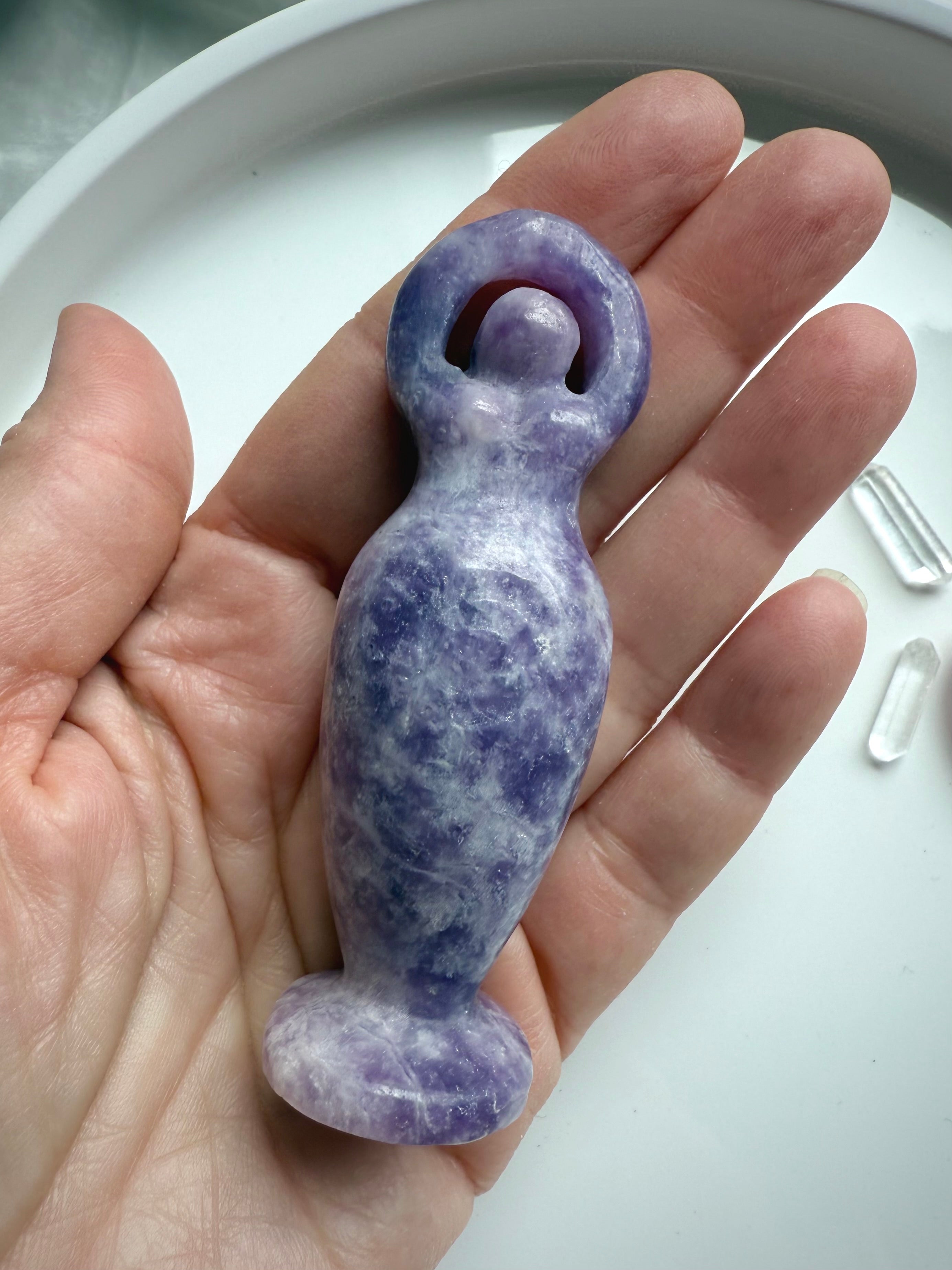 Our purple Lepidolite Standing Goddess Statue shown on my hand for scale