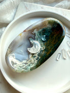 Moss Agate crystal bowl styled with Clear Quartz and Aquamarine moons and Quartz points for abundance, grounding, and crystal healing