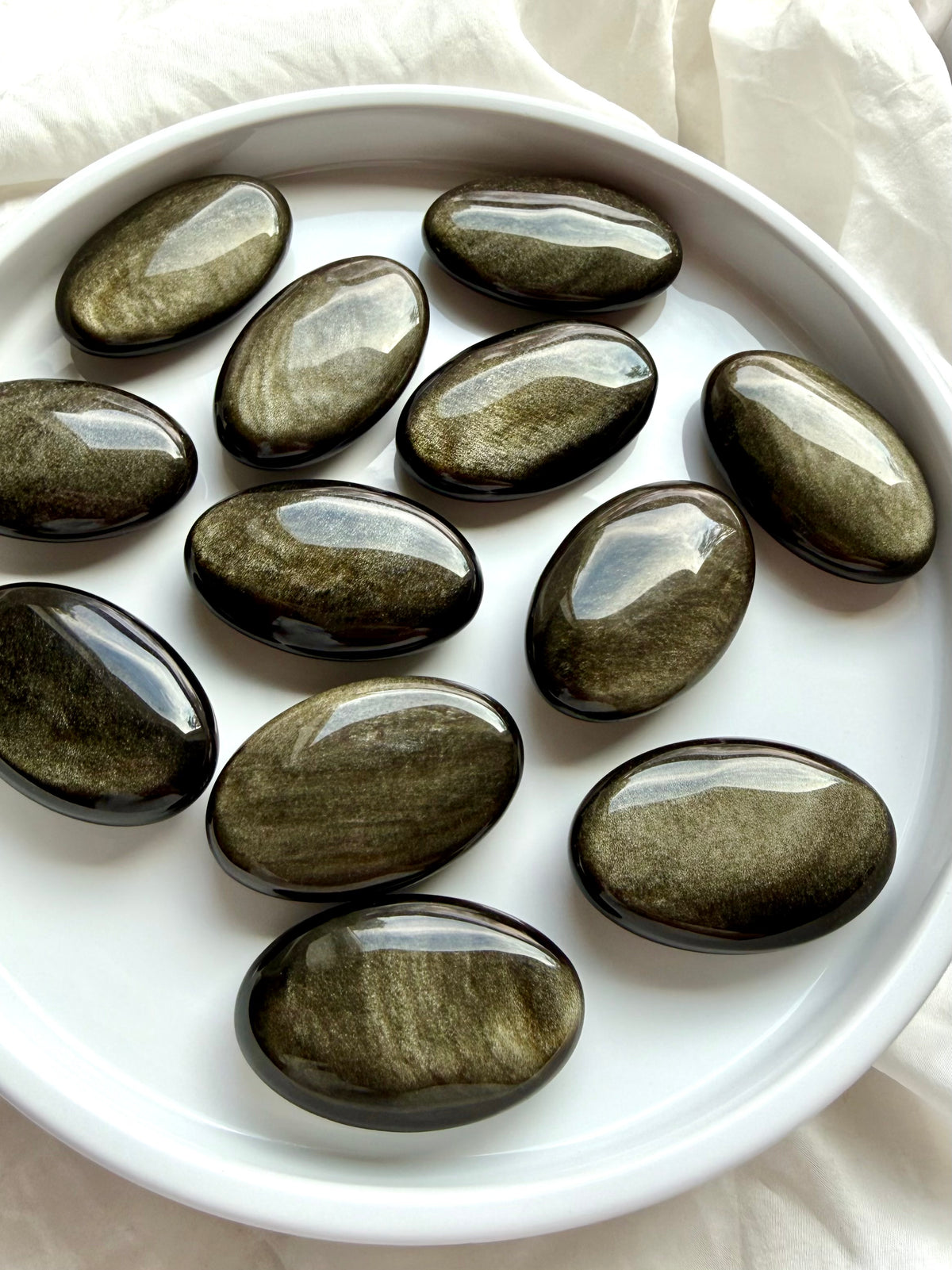 Polished Golden Sheen Obsidian palm stones with shifting gold, bronze and silvery-gold sheen for meditation and grounding