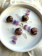 Rhodonite hearts with Amethyst and Kunzite moons, Clear Quartz points and crystal star in a Heart Chakra crystal grid