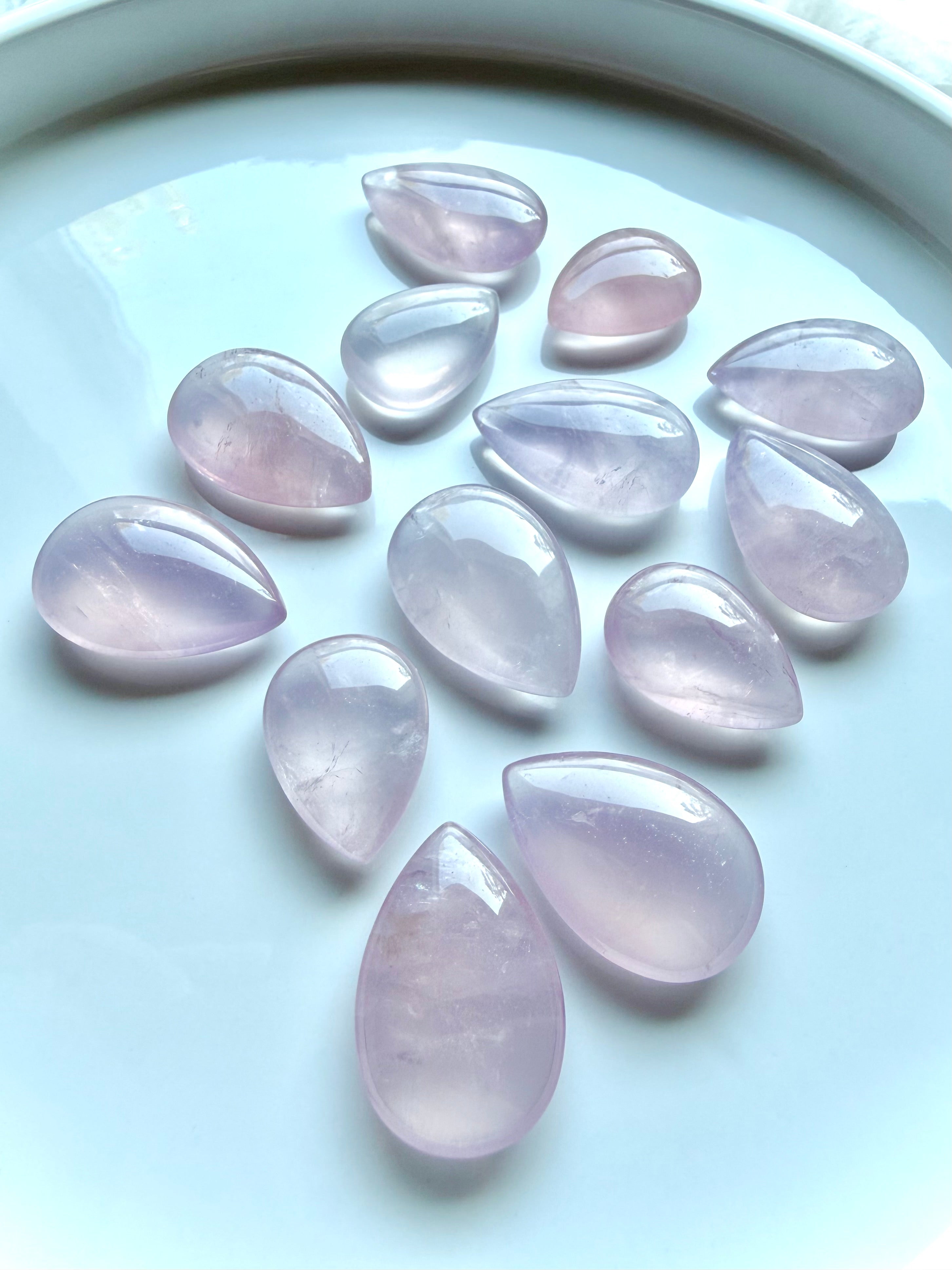 High-quality Rose Quartz teardrops from Madagascar with gemmy clarity, soft pink color and luminous Girasol character