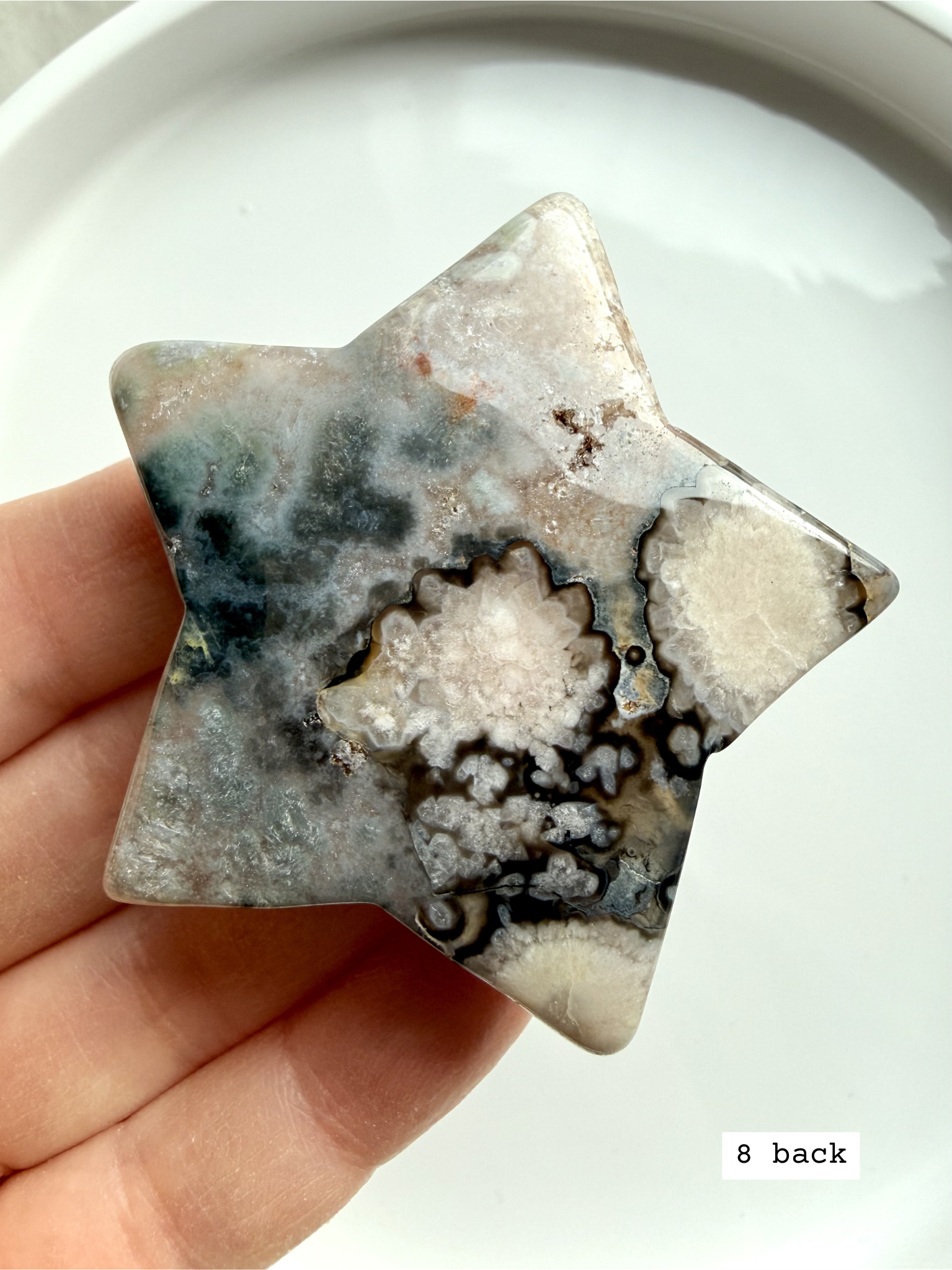 black flower agate star carving #8 front showing intricate floral plume patterns and high contrast tones