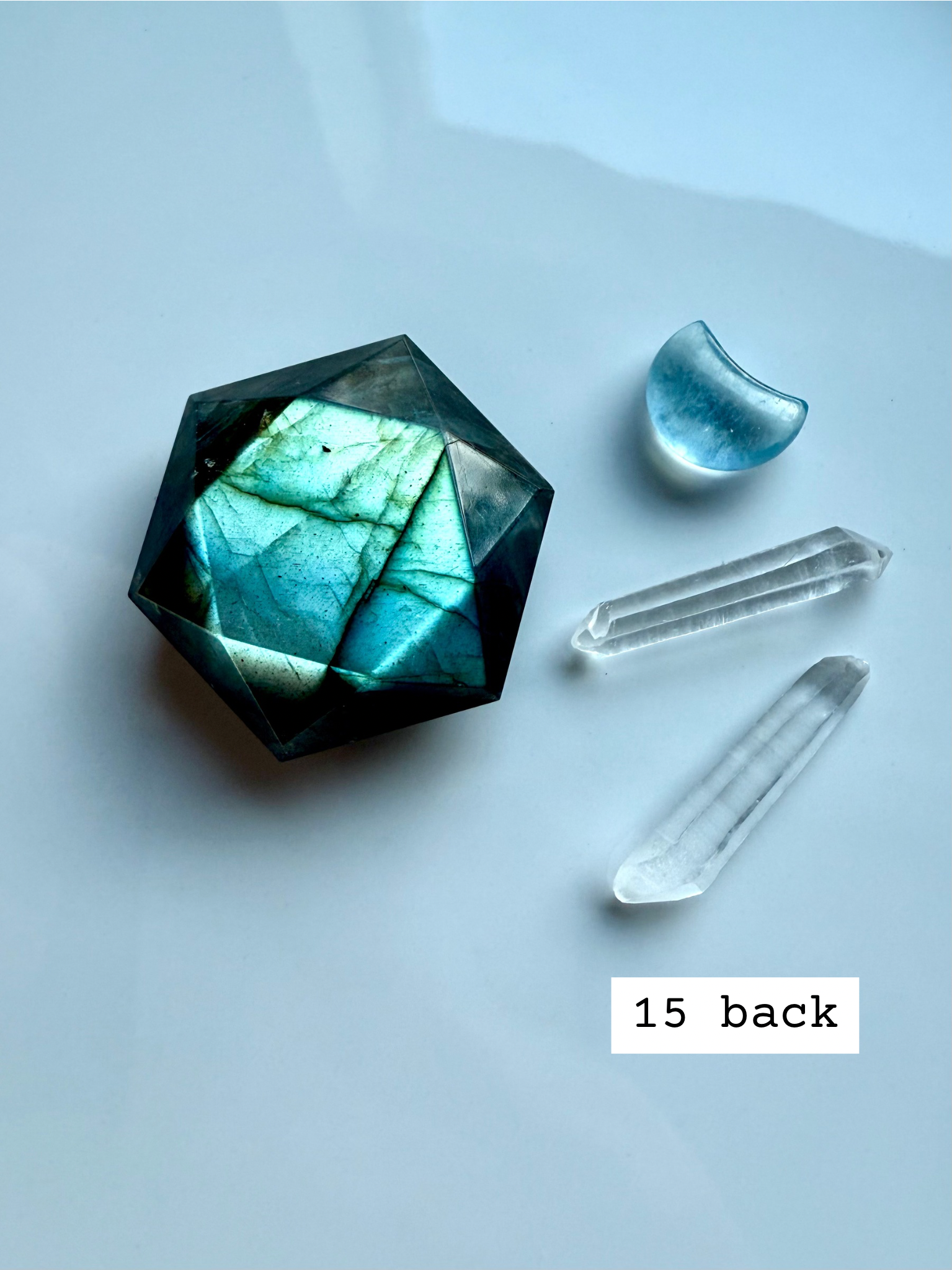 faceted labradorite hexagon with teal flash styled with quartz points labradorite star of david carving for third eye chakra activation