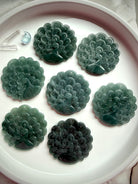 Collection of hand-carved Blue Water Jade peacock medallions in assorted natural tones
