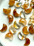 Golden Hematoid Quartz moon carvings with translucent Quartz and warm golden mineral inclusions