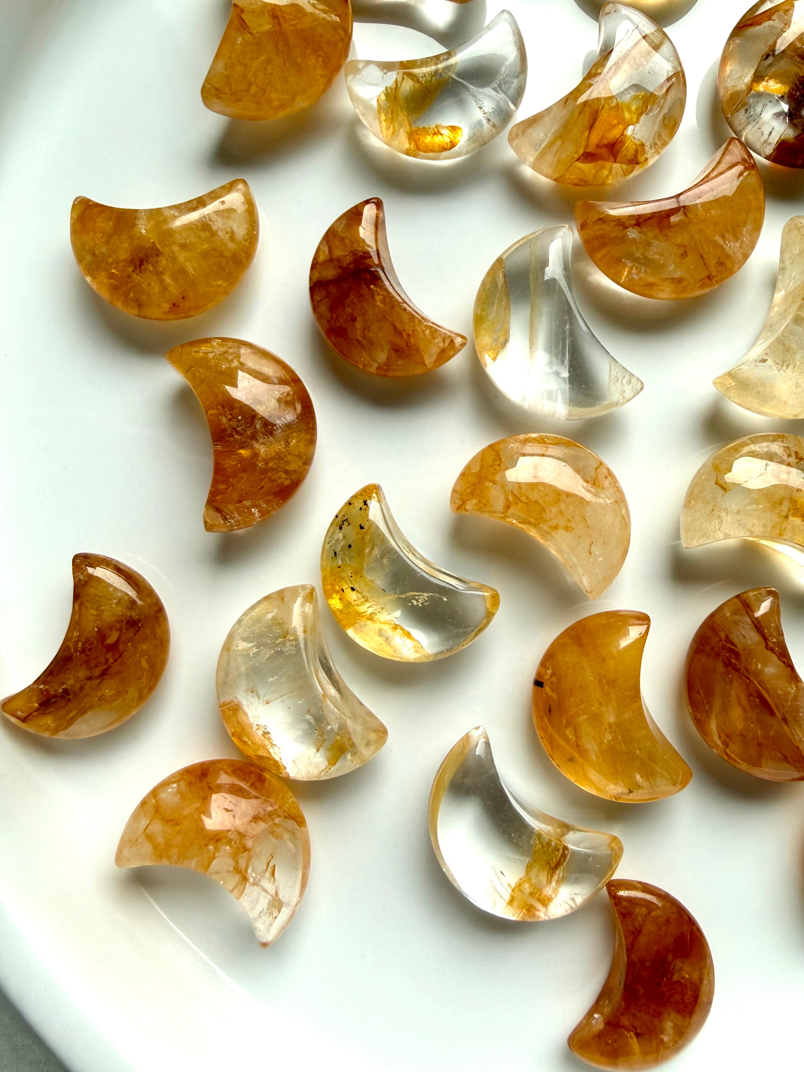 Golden Hematoid Quartz moon carvings with translucent Quartz and warm golden mineral inclusions