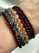 Showing both options of our faceted Red Garnet bracelets worn with Natural Citrine + Aquamarine