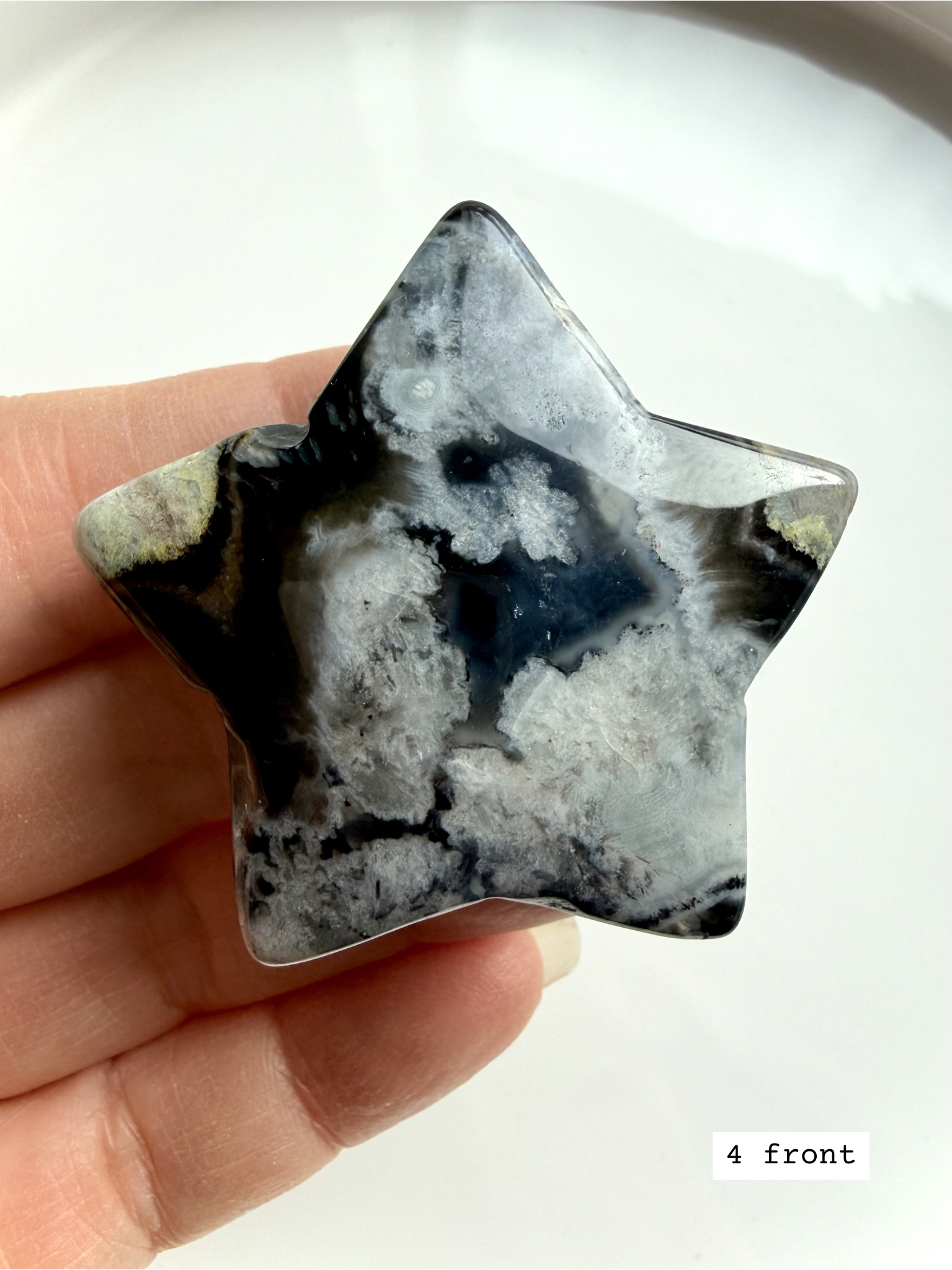 black flower agate star carving #4 front showing bold white flower inclusions and dark agate base