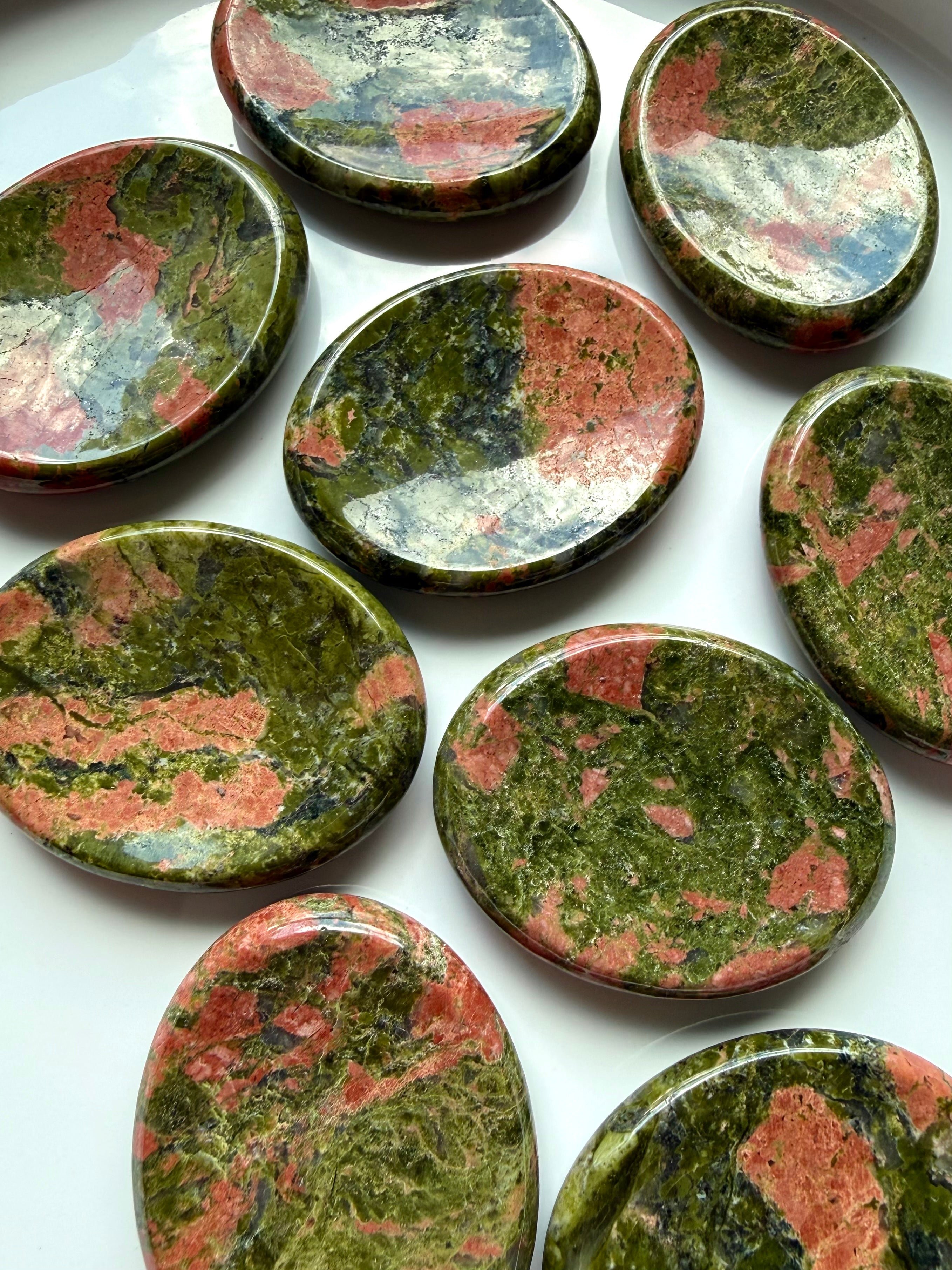 unakite worry stones arranged together for emotional balance grounding and calming energy