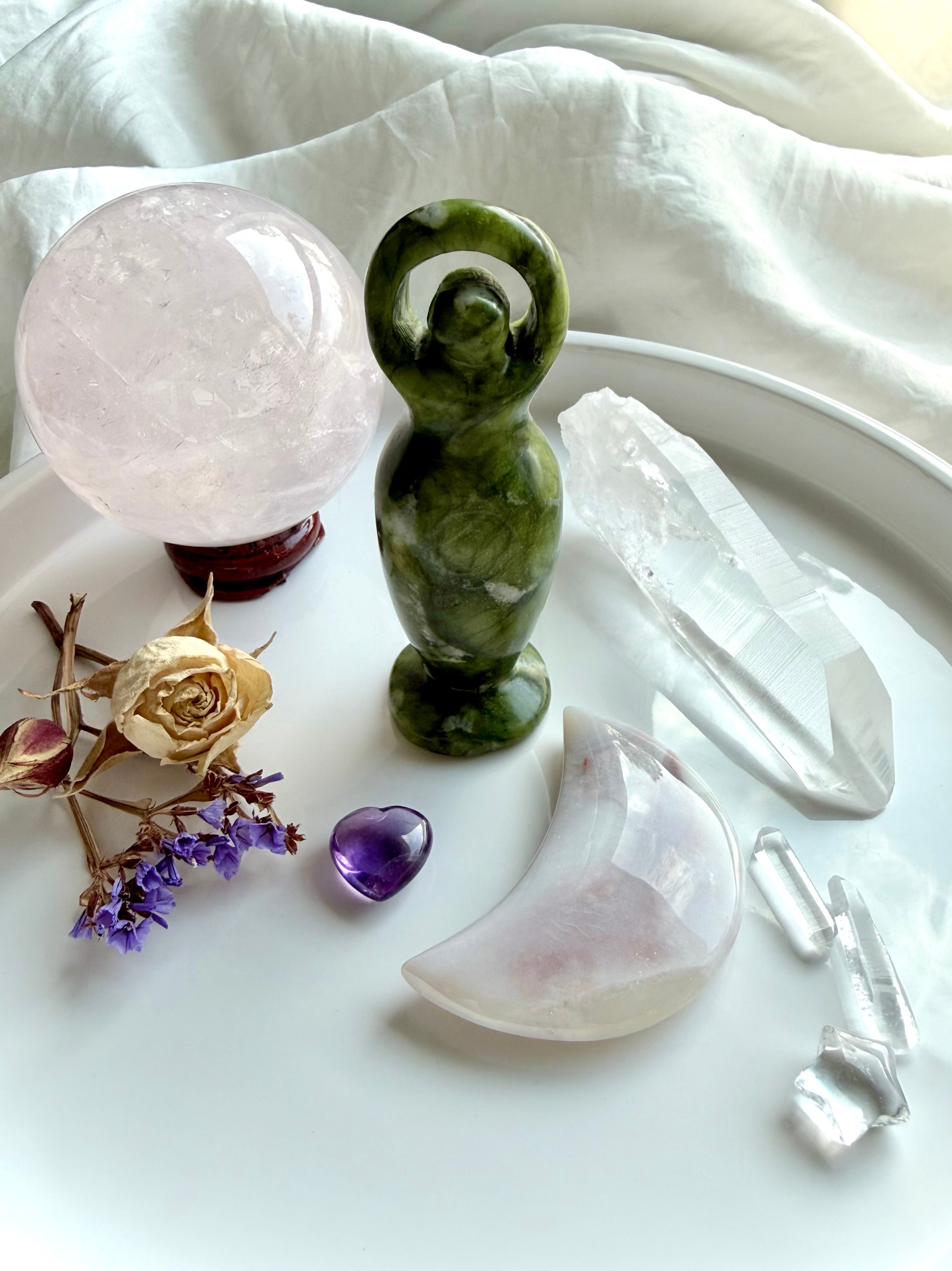 standing nephrite jade goddess figurine shown in spiritual altar styled decor, crystal carving for protection grounding and growth