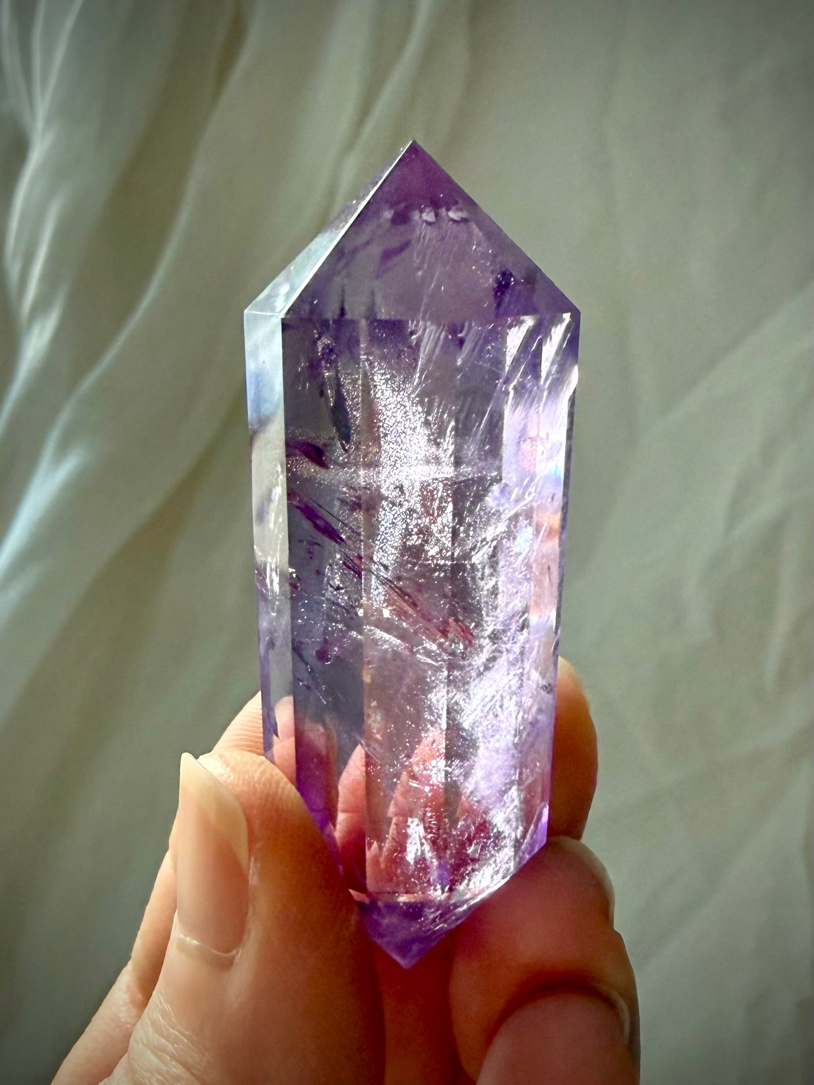 Collector-quality Amethyst Vogel crystal with rainbow flashes and exceptional clarity