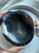 Large Orca Agate offering bowl held in hands, showing deep swirling patterns — soothing grounding crystal bowl for protection, calm, and ceremonial use.
