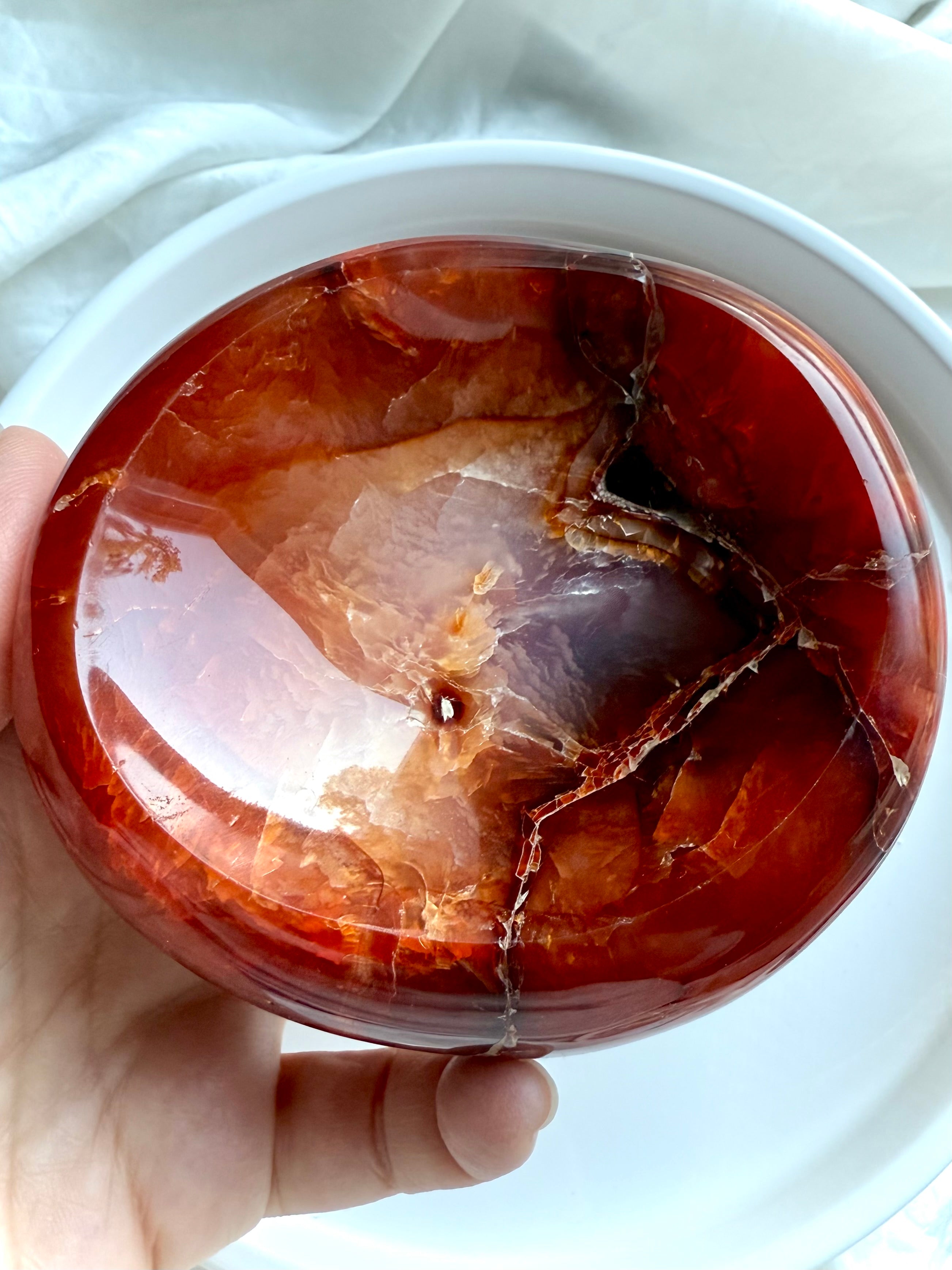 Polished Carnelian crystal bowl showing fiery orange and deep red banding – natural stone dish for creativity and vitality