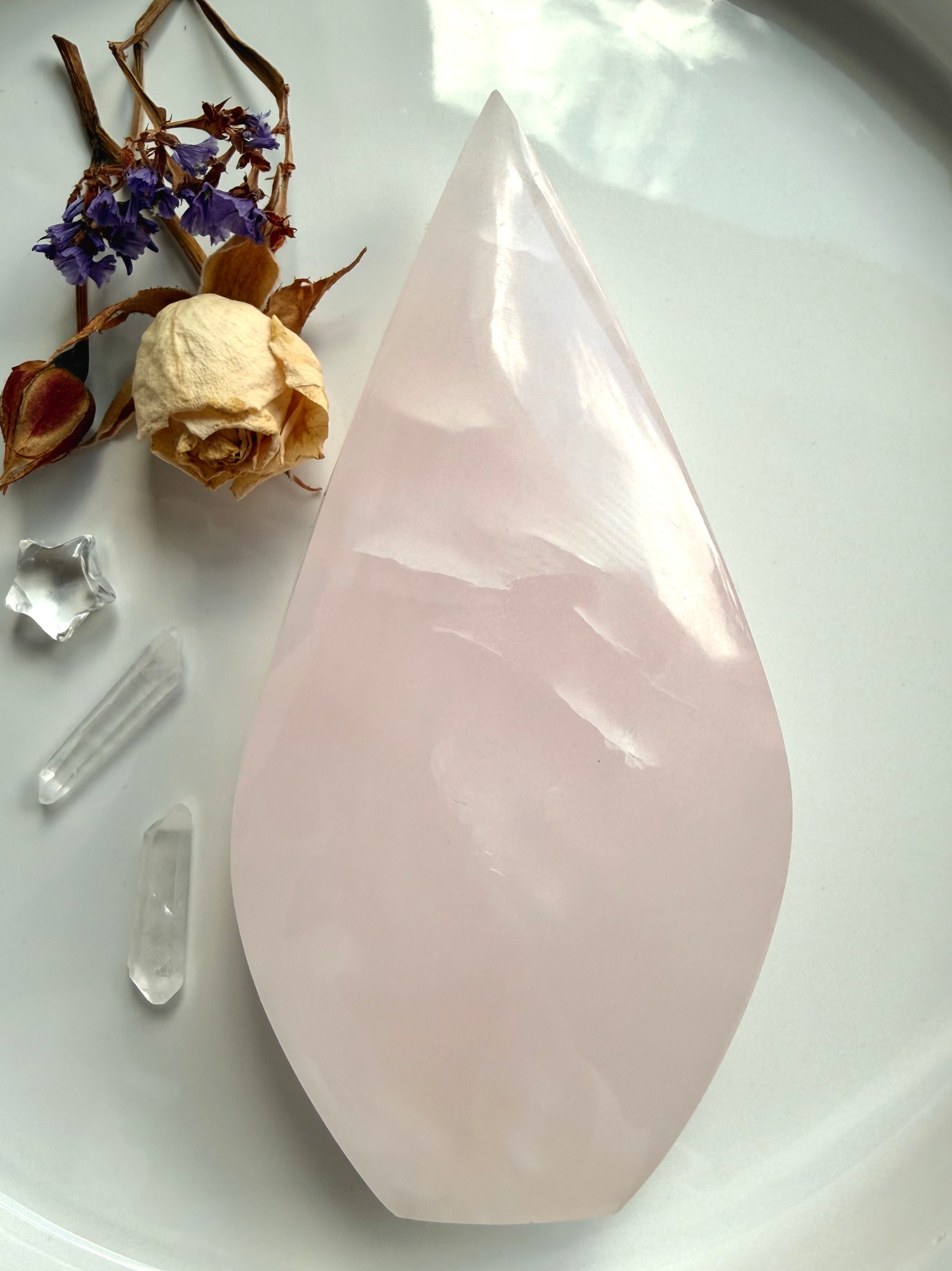 Mangano Calcite flame carving with soft blush pink color and polished finish for emotional healing and heart chakra work