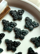 Collection of Wuji jade butterfly carvings in dark green Guatemalan jade crystal