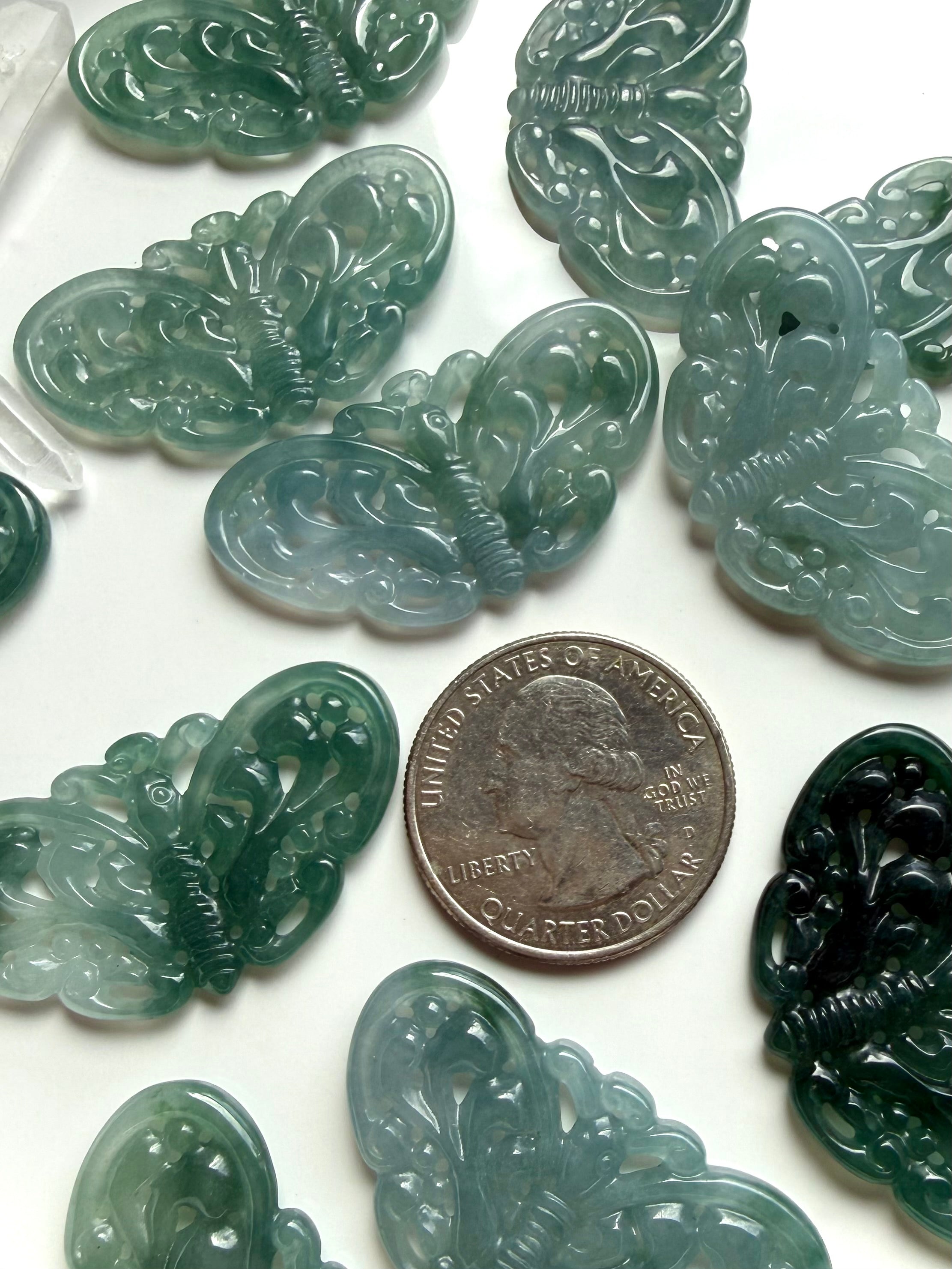 Blue Water Jade butterfly carvings with quarter for size reference
