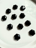 Mini hexagon gems grouped together on white background