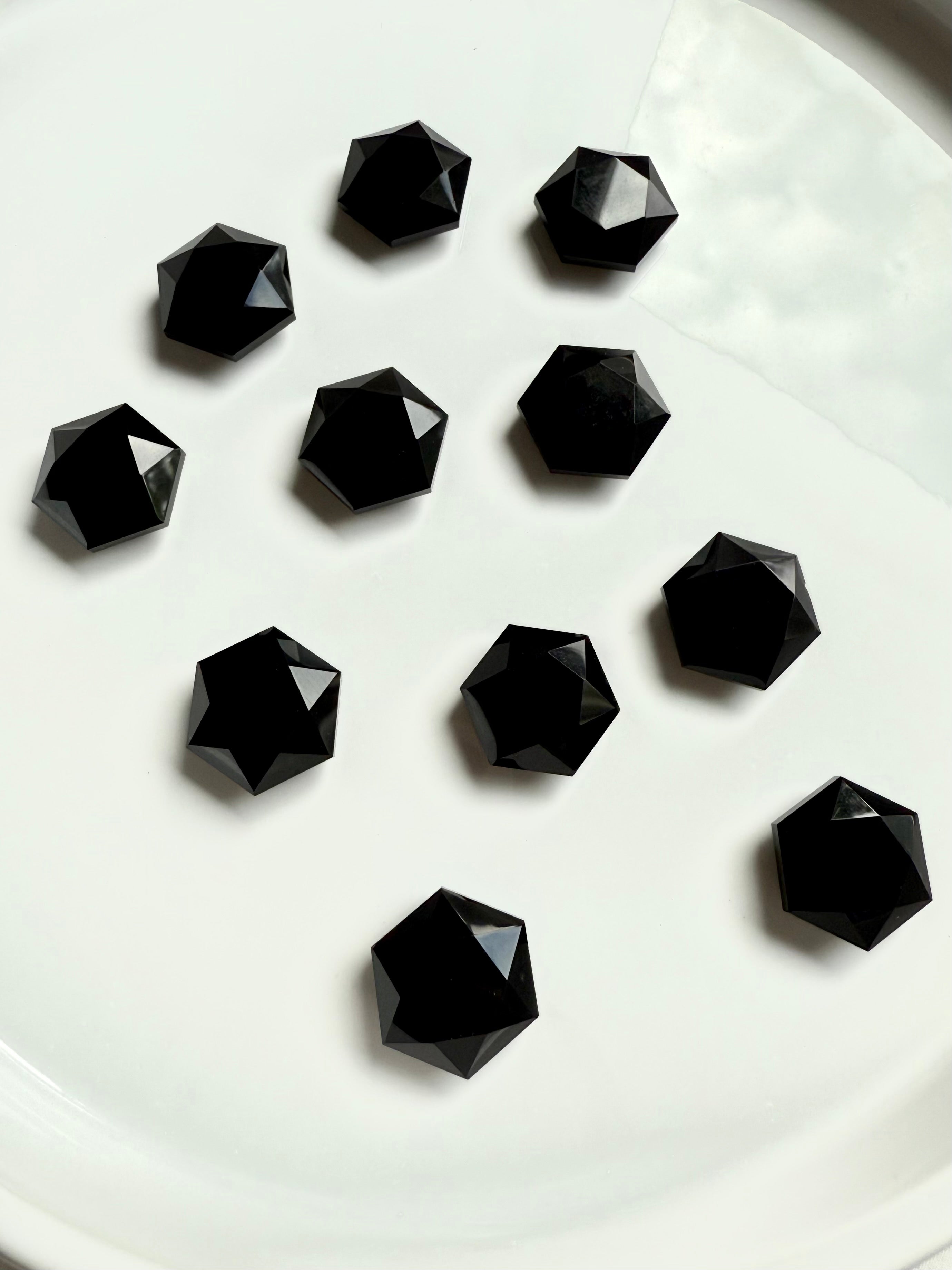 Mini hexagon gems grouped together on white background