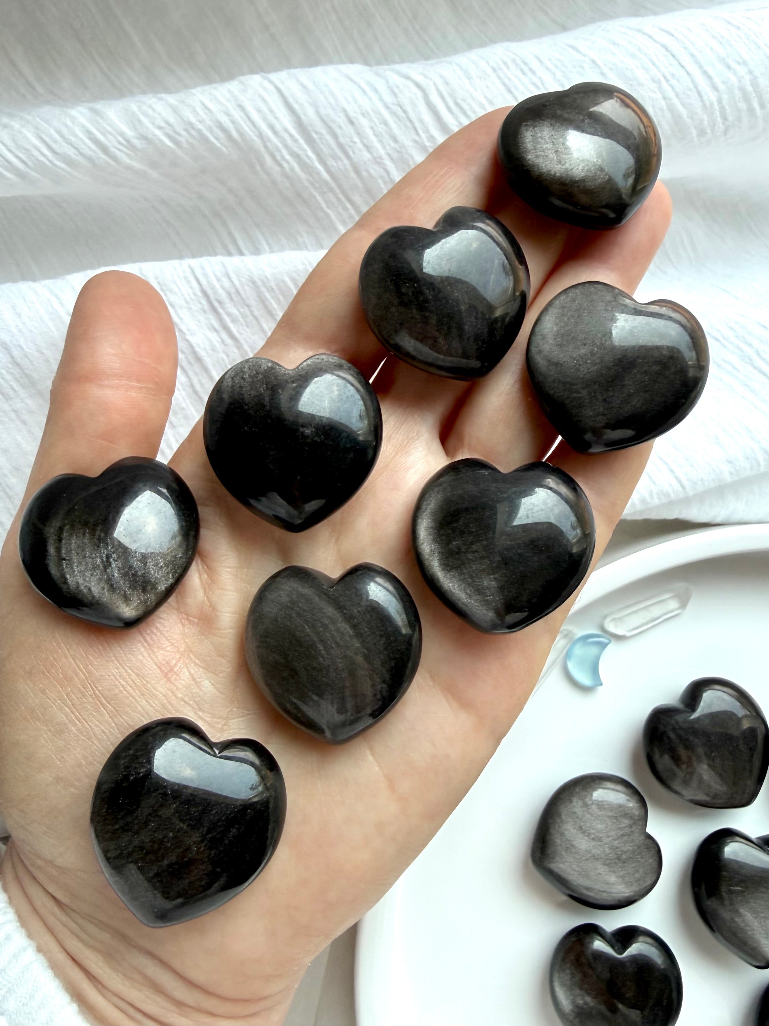 Silver Sheen Obsidian hearts held in hand for grounding, energetic protection and intuition
