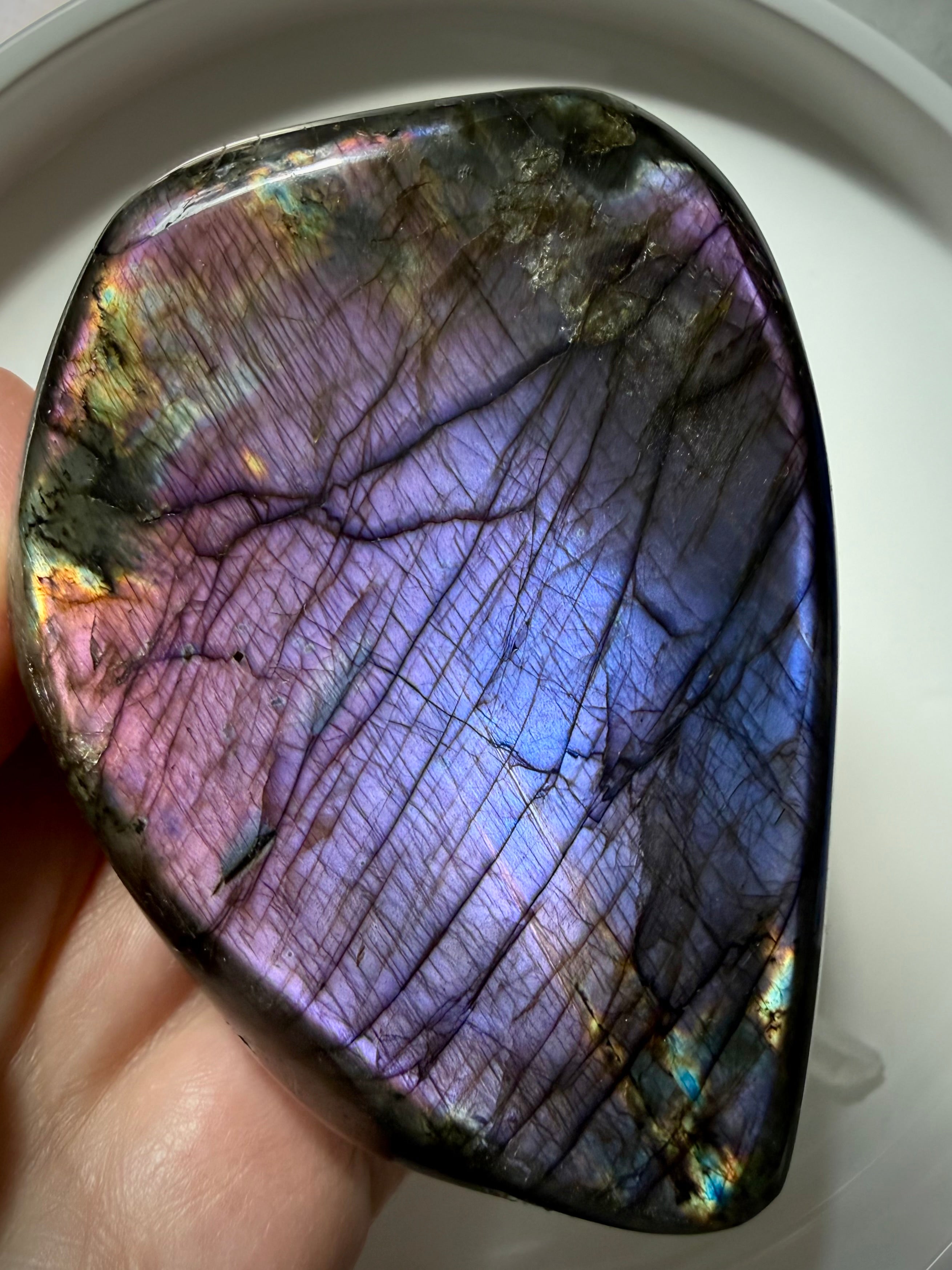 Pink purple Labradorite crystal showing brilliant lavender and violet labradorescence with vibrant rainbow colors