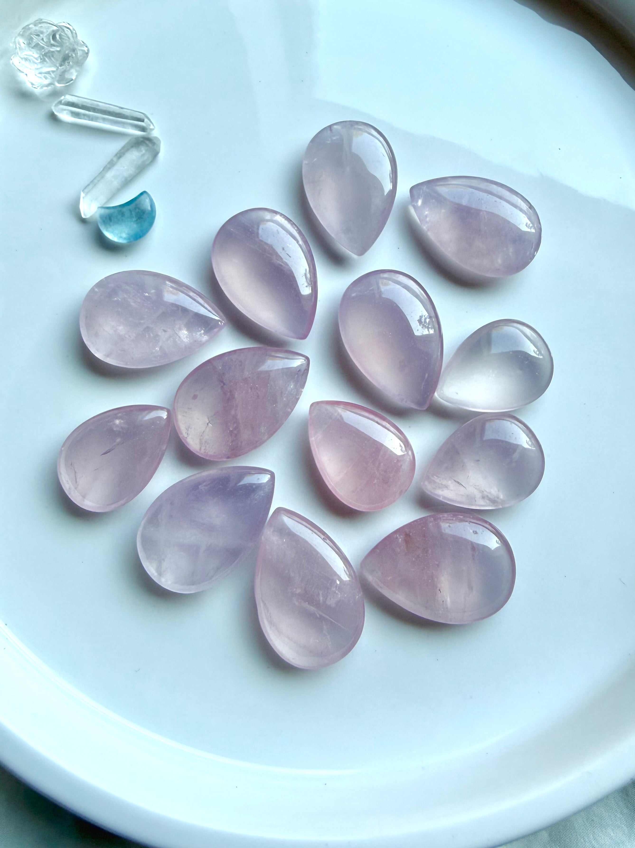 emmy Rose Quartz teardrops showing exceptional clarity, luminous pink color and softly rounded polished surfaces