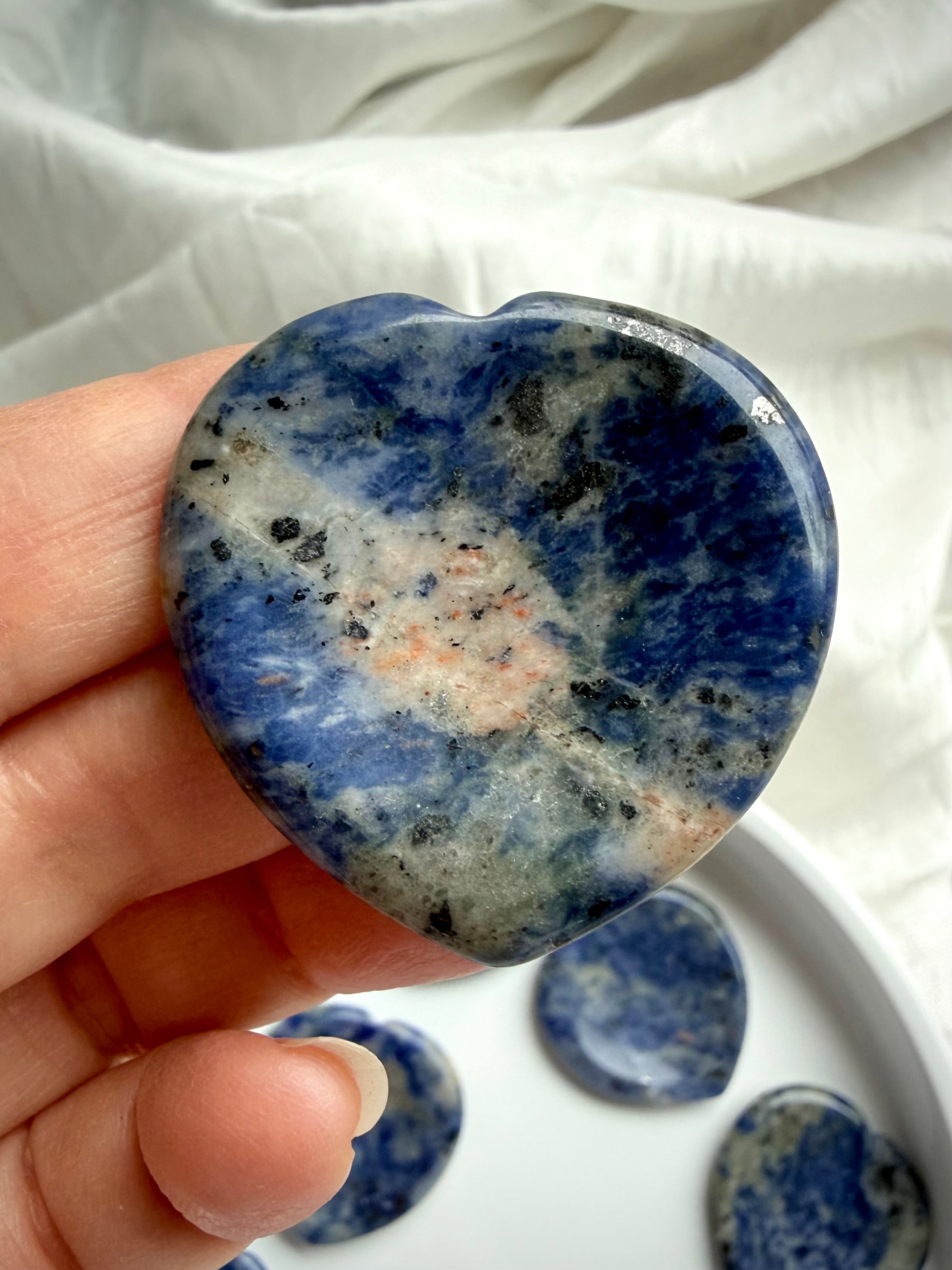 Polished sodalite heart worry stone with thumb indentation – blue throat chakra crystal