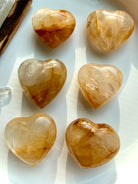golden healer crystal hearts arranged together with honey gold tones and natural internal veils