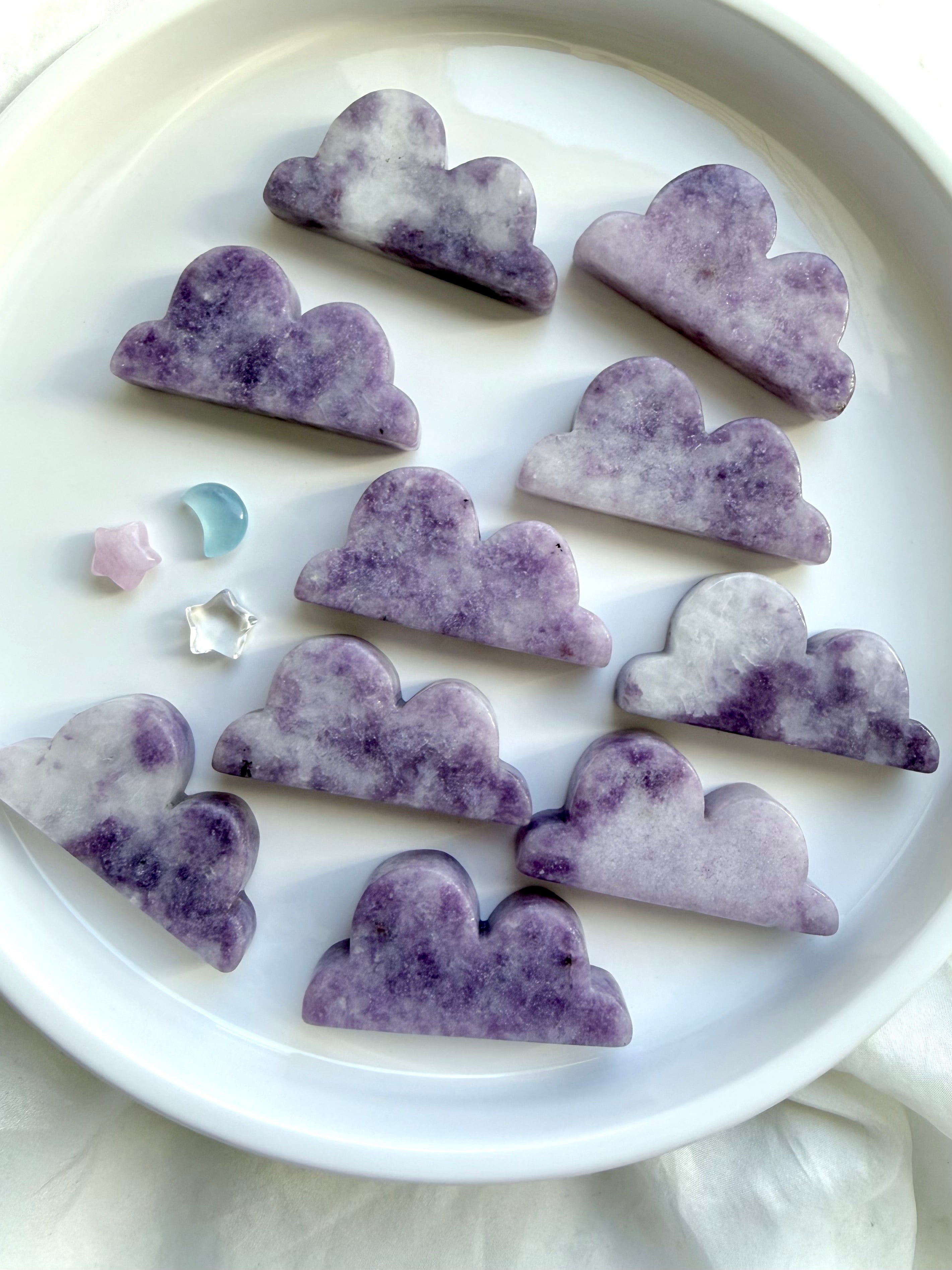 Assorted Lepidolite cloud crystal carvings in soft lavender tones with natural mottling and unique patterns