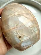 Polished Peach Moonstone freeform with soft shimmer, creamy banding, and feminine calming energy