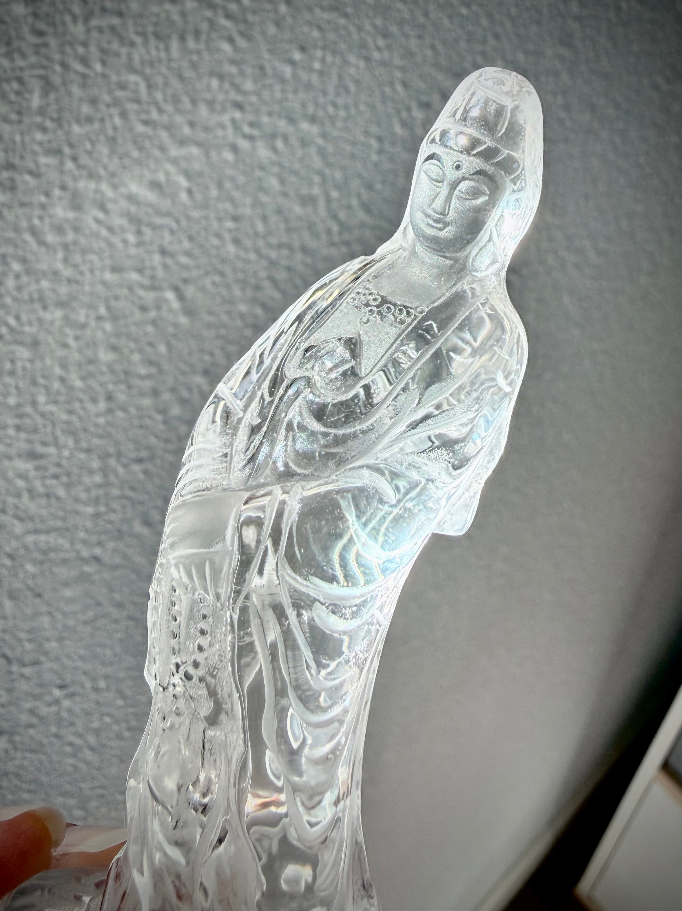 Natural Clear Quartz Quan Yin carving with ethereal light and intricate detail from every angle