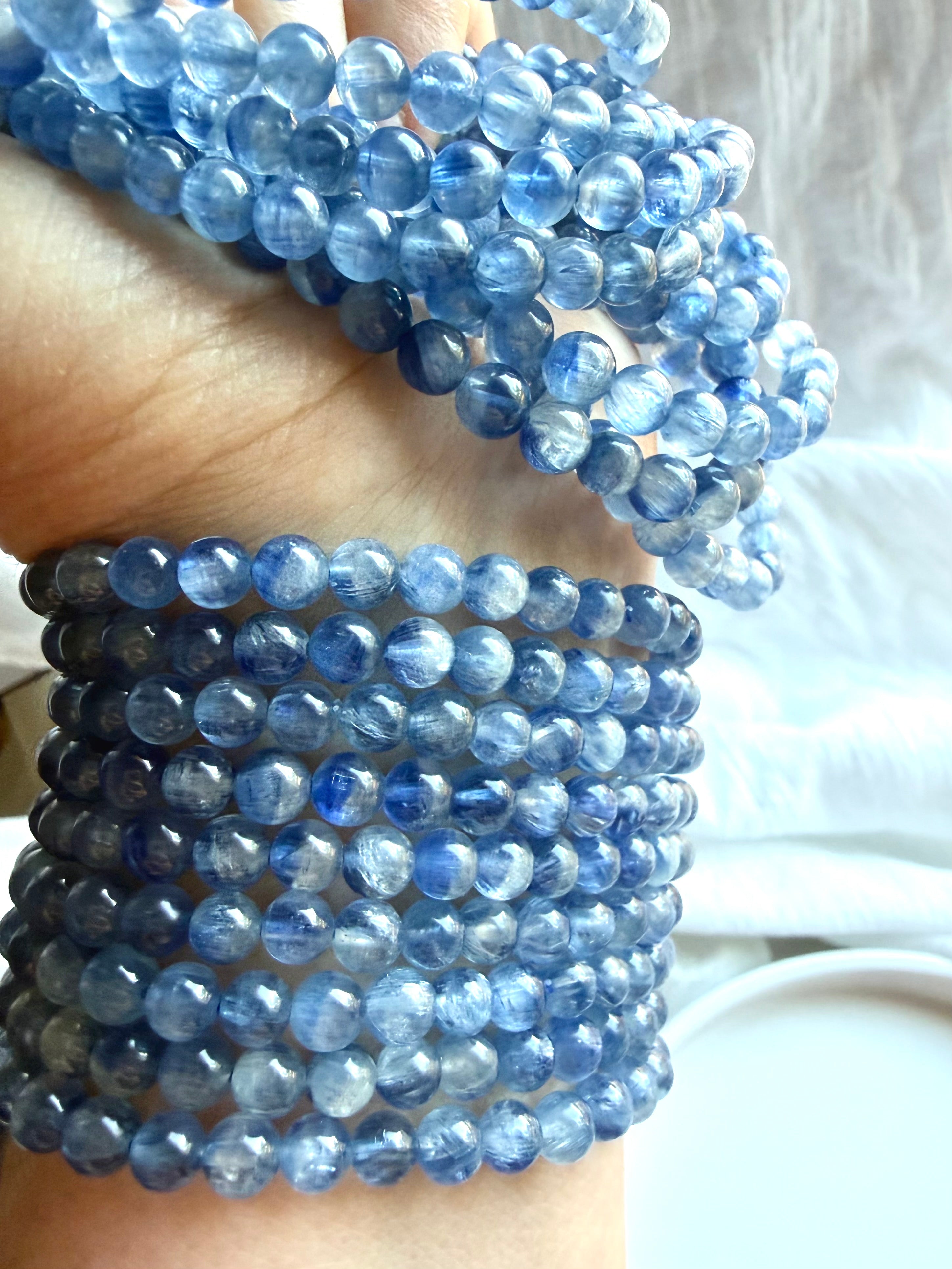 Blue Kyanite gemstone bracelets stacked together to show natural color variation and silky texture
