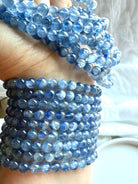 Blue Kyanite gemstone bracelets stacked together to show natural color variation and silky texture