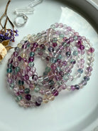 Fluorite beaded bracelet styled with natural crystals to evoke focus, intuition, and mindful energy