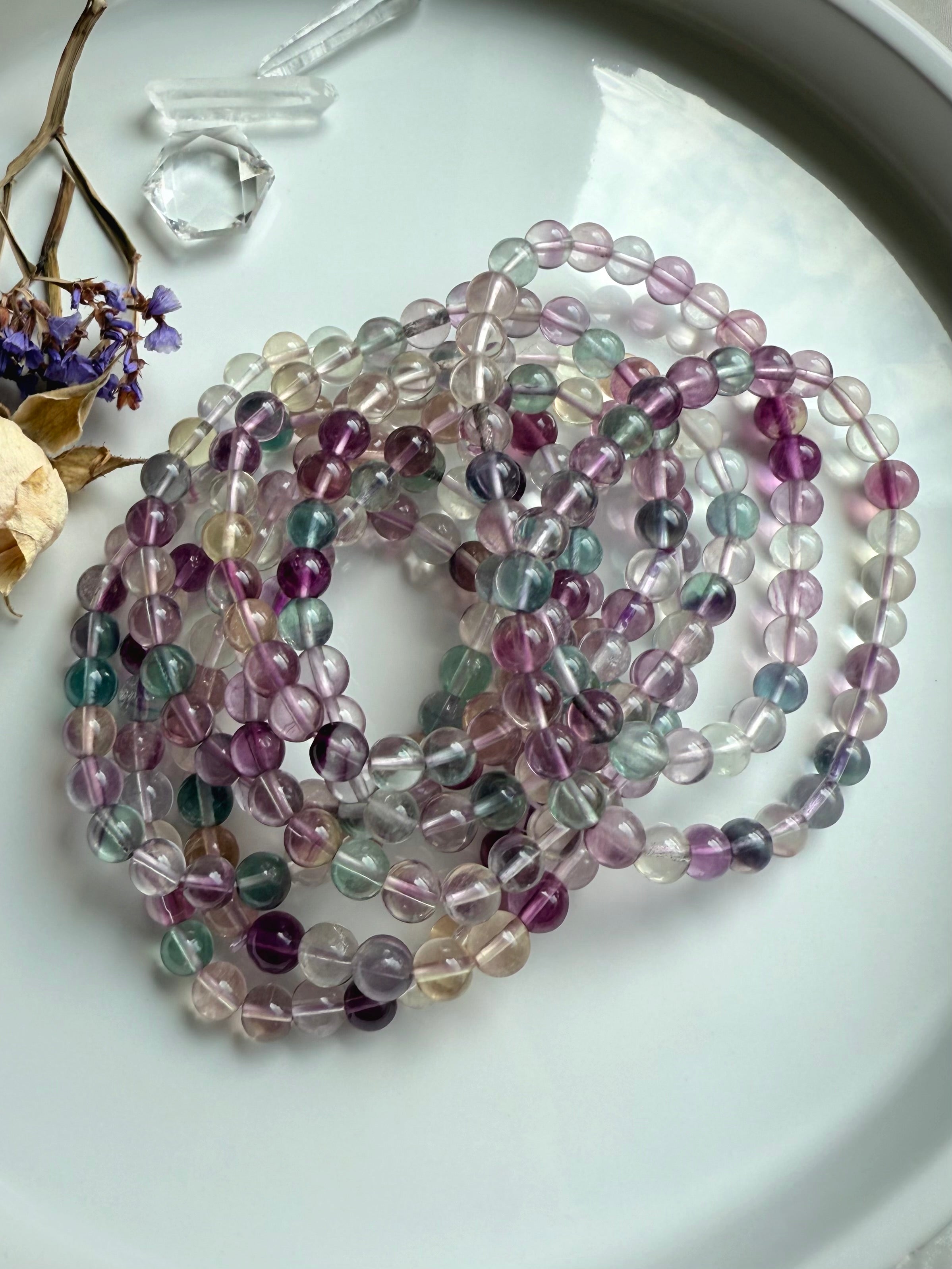 Fluorite beaded bracelet styled with natural crystals to evoke focus, intuition, and mindful energy