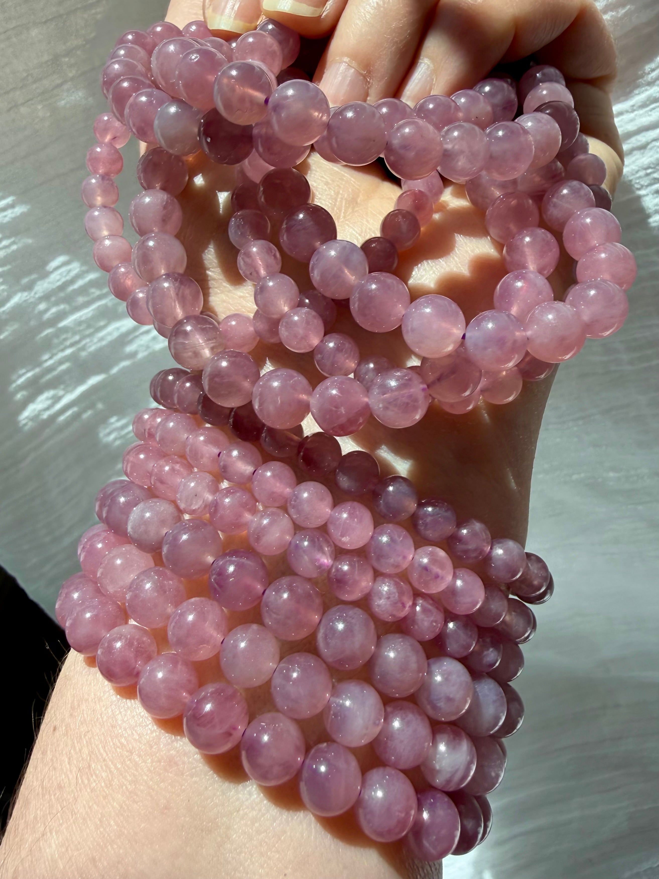 Lavender Rose Quartz Bracelet displaying translucent gemstone beads with gentle inner glow and natural color variation