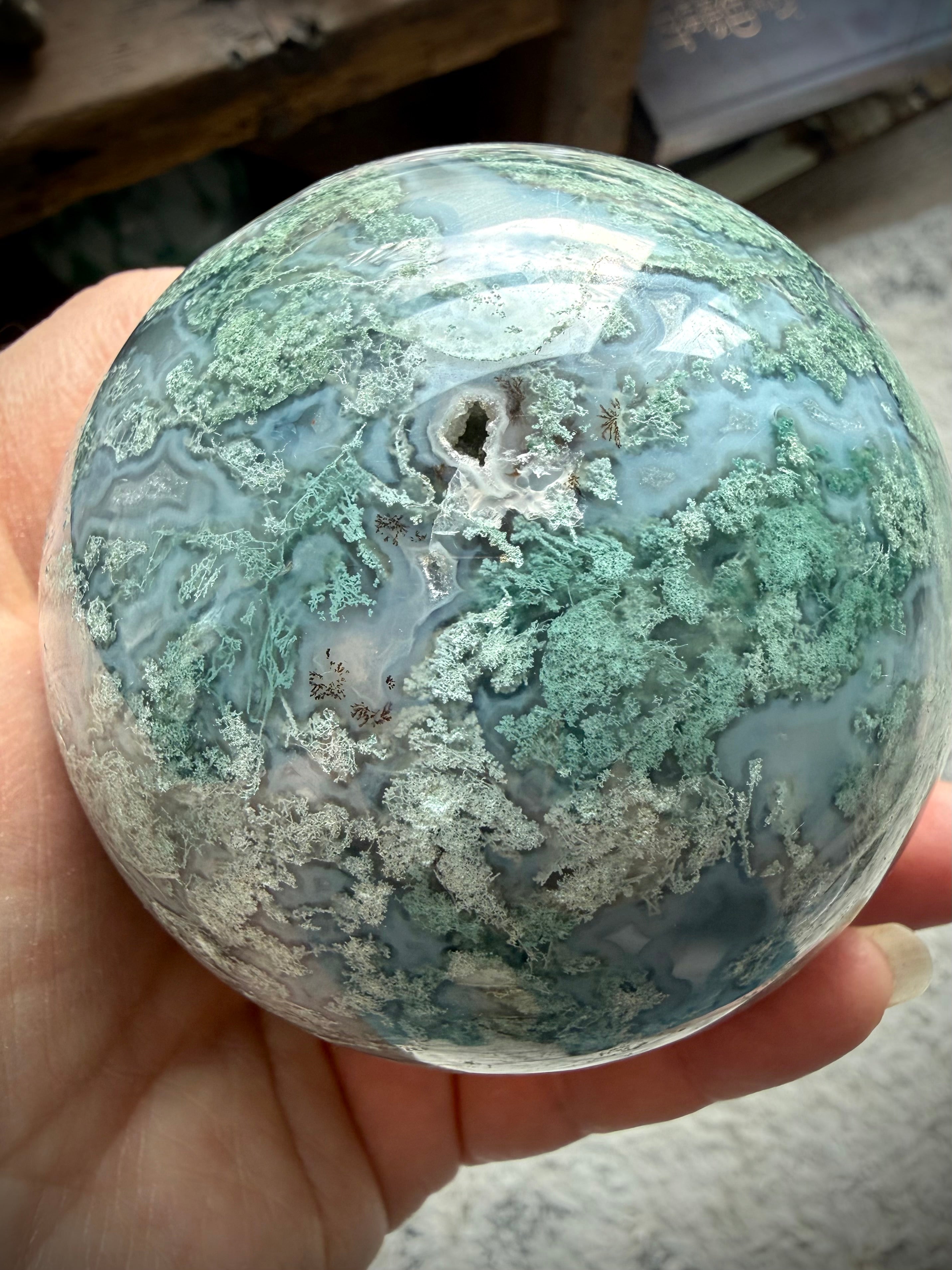 Lacy Moss Agate sphere with Quartz vein, druzy crystal details, and intricate green mineral patterns