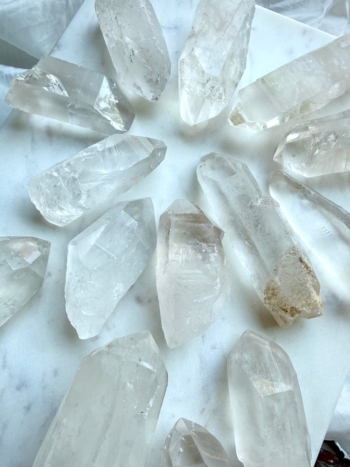 Chunky Lemurian Quartz points from Brazil with natural ladder lines, cloudy inclusions, and varied raw crystal formations