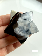black flower agate star carving #4 back showing softer plume formations and polished stone texture