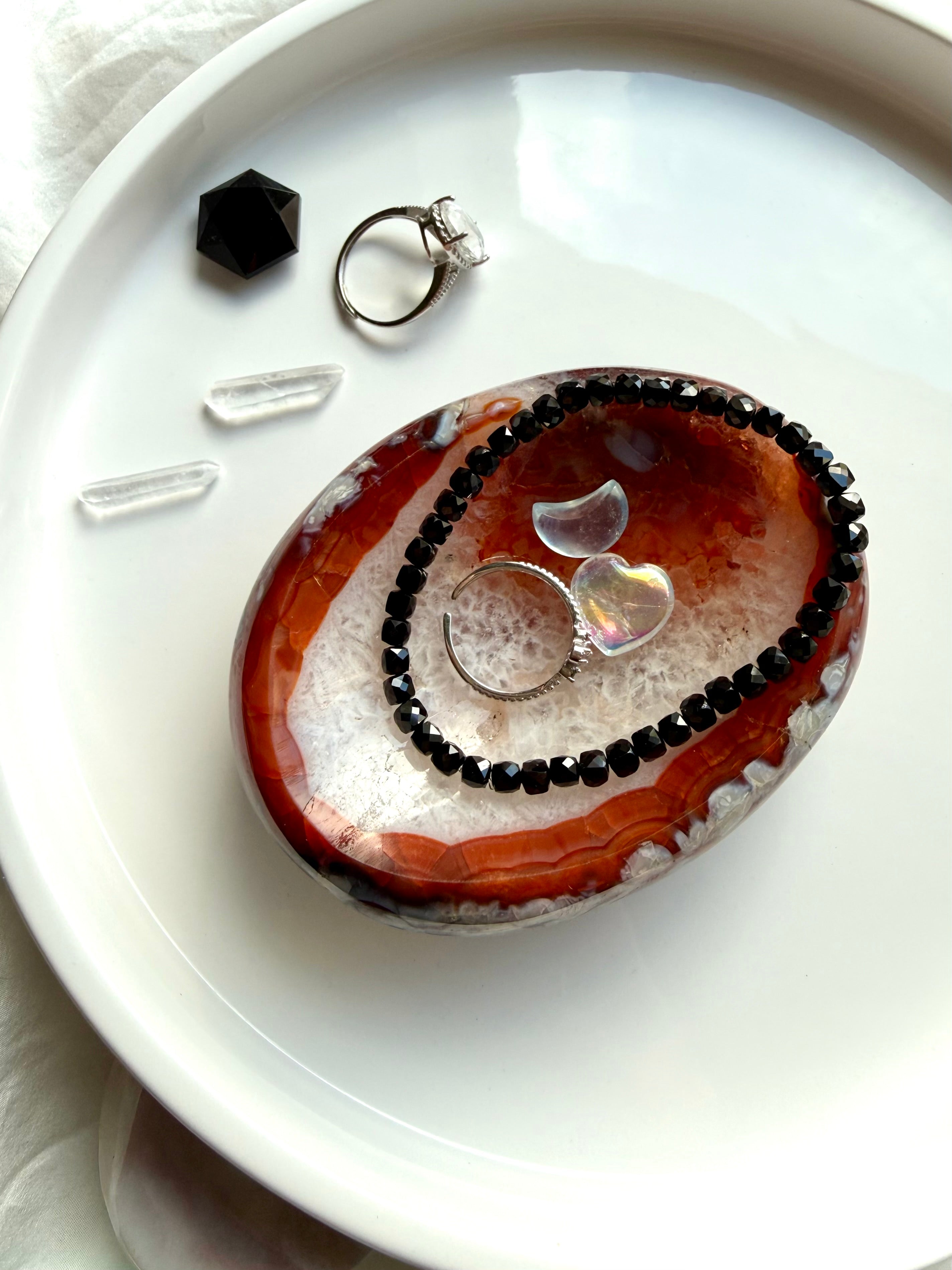 black spinel bracelet styled with carnelian crystal bowl for grounding protection and energy work