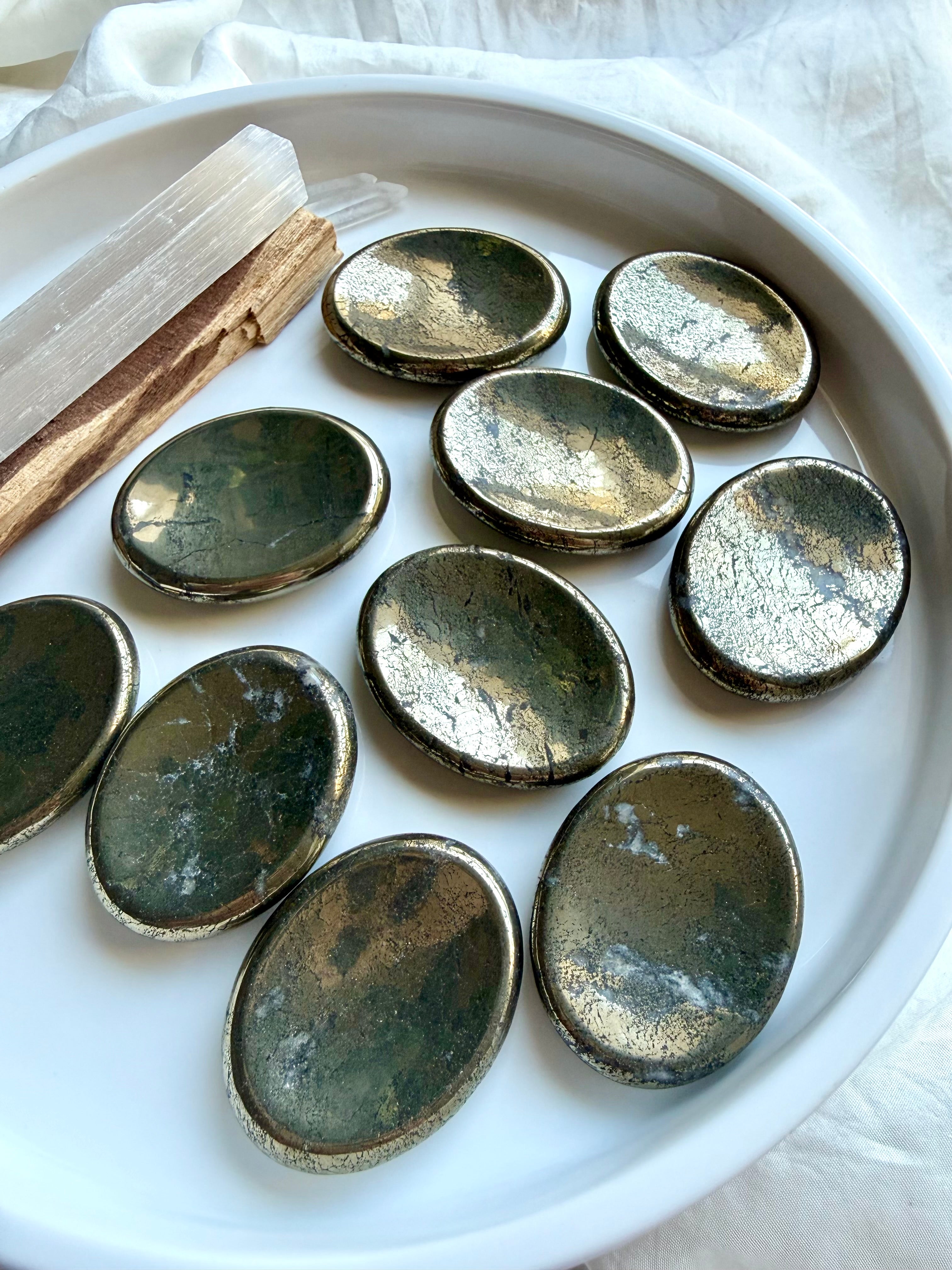 Oval Pyrite worry stones with metallic gold luster and varied natural inclusions for meditation and grounding