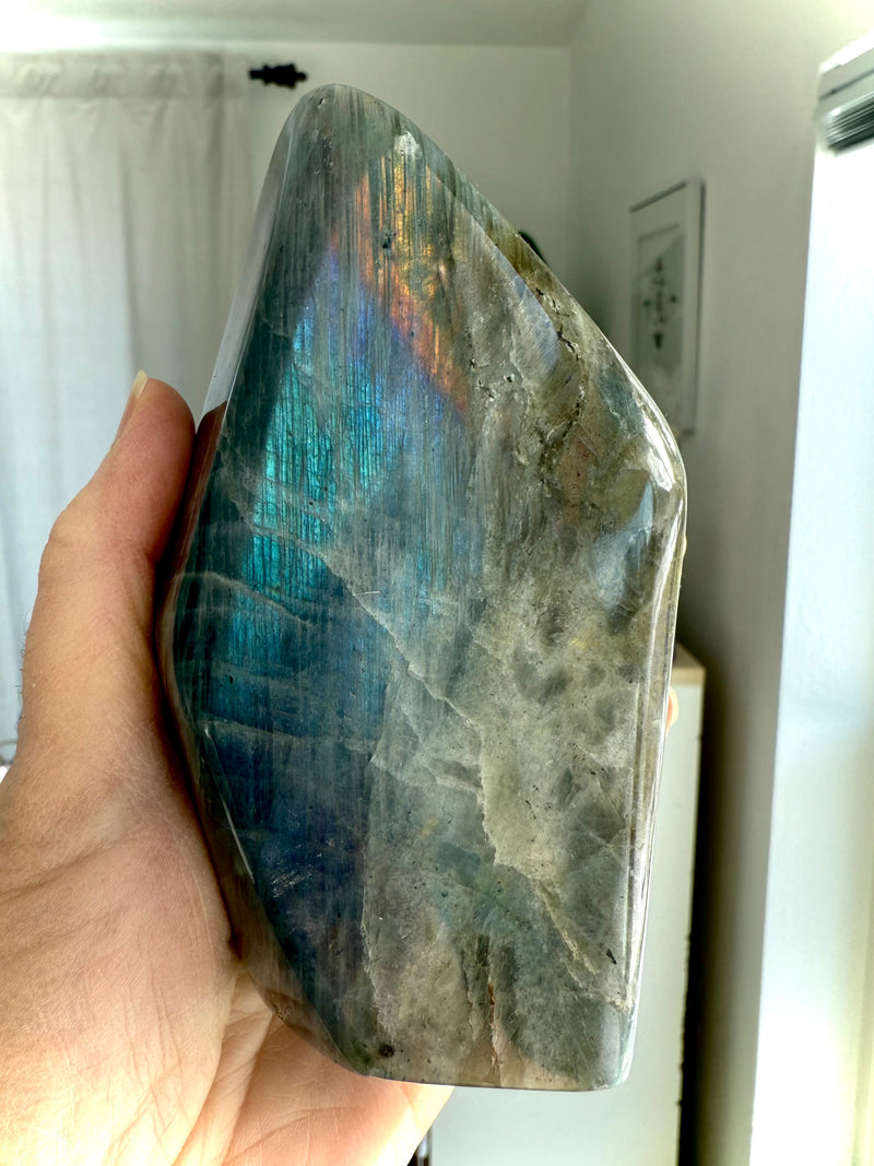 the back side of the labradorite freeform has a pretty peacock blue flash