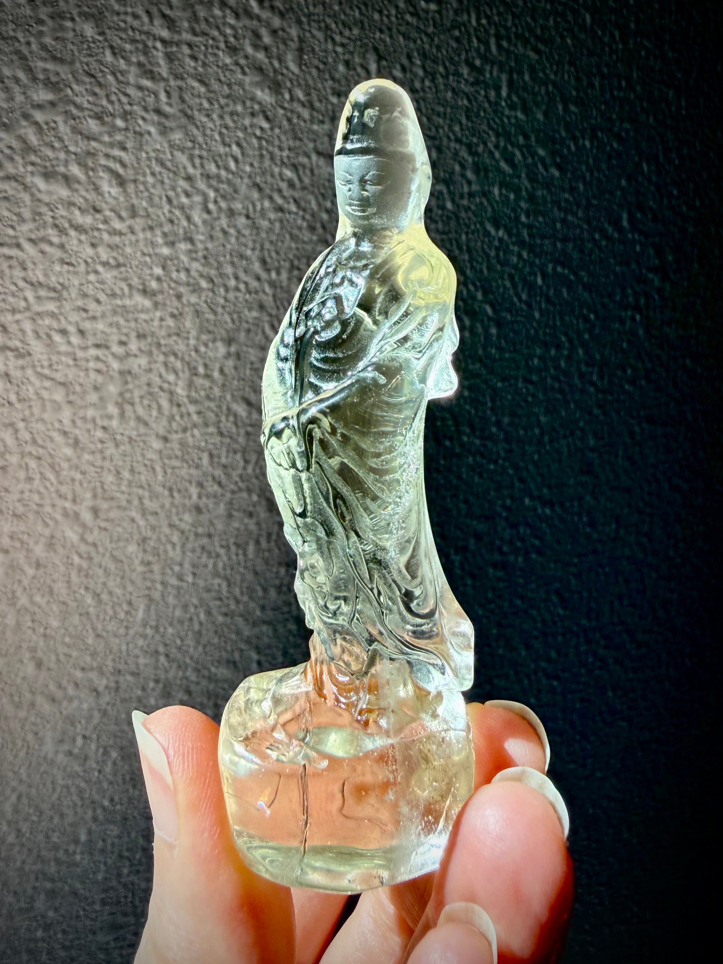 citrine Quan Yin statue carved from natural crystal with golden tones for joy abundance and spiritual protection