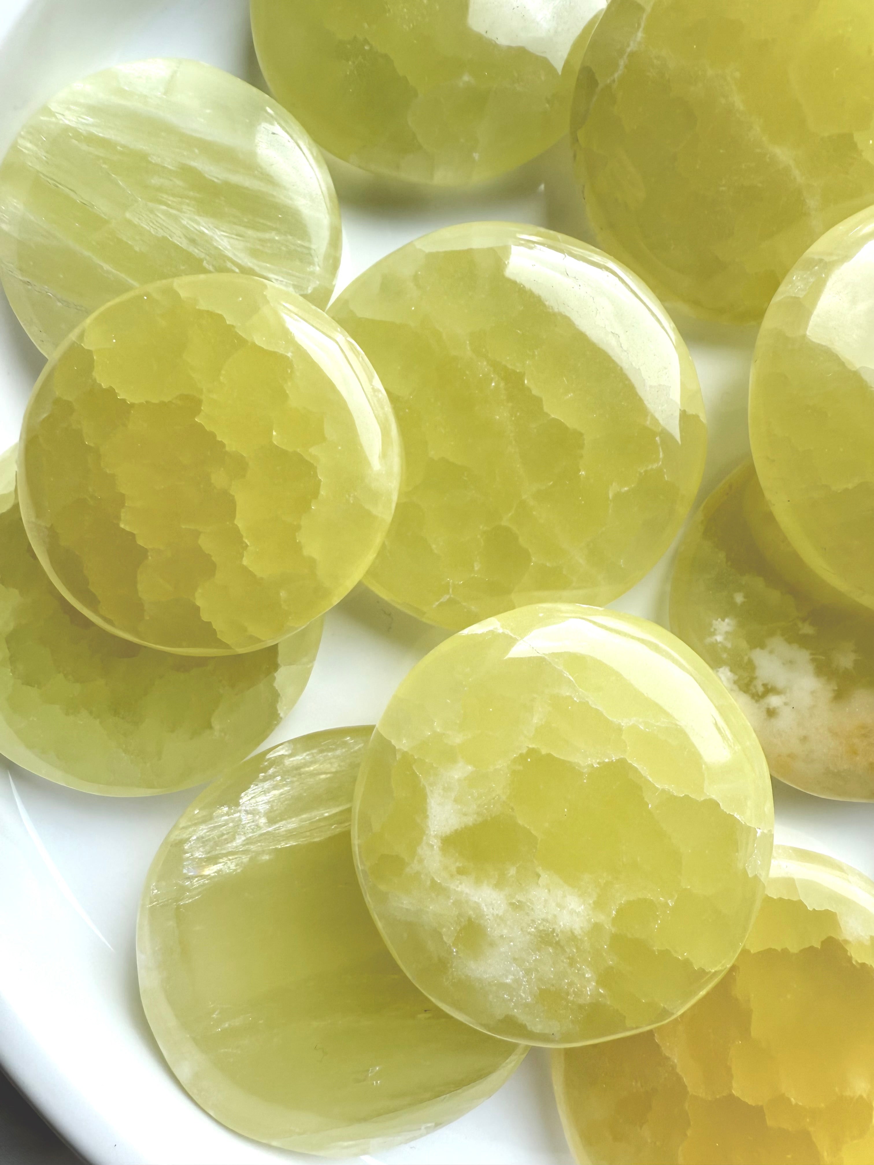 Cluster of lemon calcite stones with glowing translucent quality and organic veining