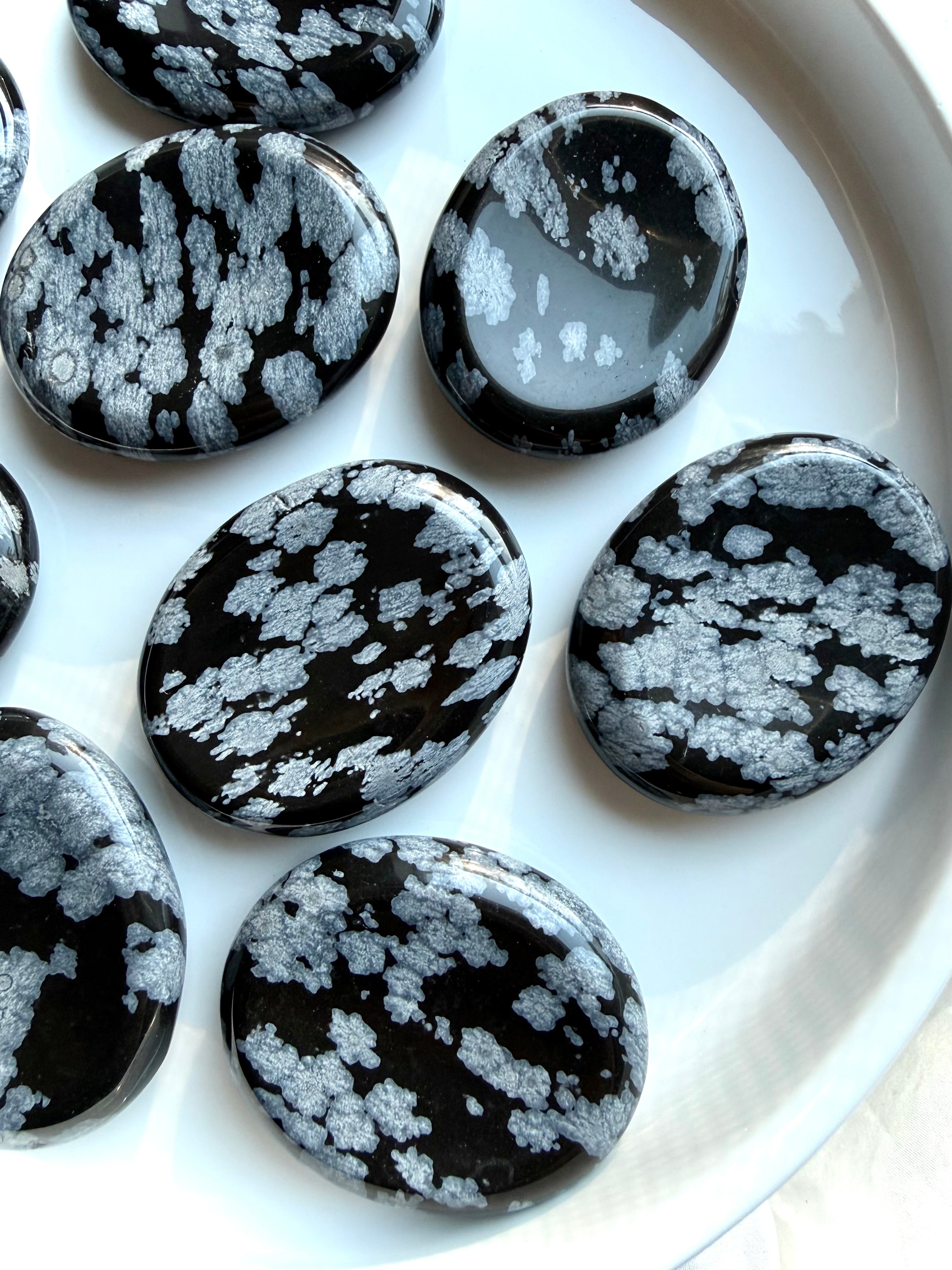 Polished Snowflake Obsidian stones for stress relief and chakra healing