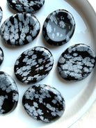 Polished Snowflake Obsidian stones for stress relief and chakra healing